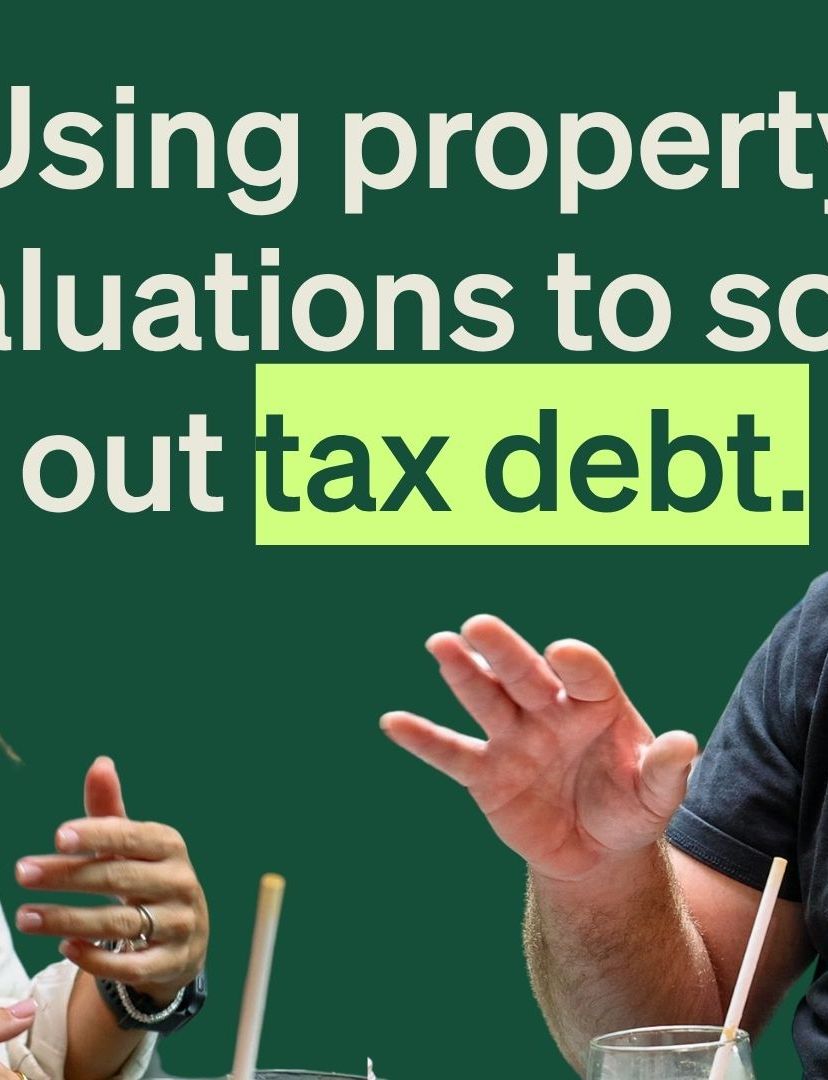 A smiling woman and a bearded man talking with the text "Using property valuations to sort out tax debt."