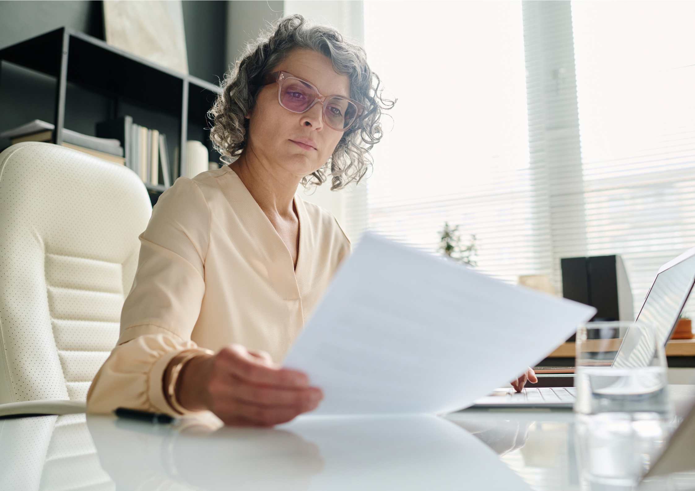 A professional woman with grey curly hair and pink glasses sits at a desk, intently reading papers with a laptop nearby.​​​​‌﻿‍﻿​‍​‍‌‍﻿﻿‌﻿​‍‌‍‍‌‌‍‌﻿‌‍‍‌‌‍﻿‍​‍​‍​﻿‍‍​‍​‍‌﻿​﻿‌‍​‌‌‍﻿‍‌‍‍‌‌﻿‌​‌﻿‍‌​‍﻿‍‌‍‍‌‌‍﻿﻿​‍​‍​‍﻿​​‍​‍‌‍‍​‌﻿​‍‌‍‌‌‌‍‌‍​‍​‍​﻿‍‍​‍​‍‌‍‍​‌﻿‌​‌﻿‌​‌﻿​​‌﻿​﻿​﻿‍‍​‍﻿﻿​‍﻿﻿‌‍﻿‌‌‍​‌‌‍​﻿‌‍‍﻿‌‍​‌‌﻿‍‌​‍﻿‌‌‍‌﻿‌‍﻿﻿‌‍﻿﻿‌‍‌​‌﻿‌﻿‌‍‍‌‌‍﻿‍​‍﻿‍‌﻿​﻿‌‍​‌‌‍﻿‍‌‍‍‌‌﻿‌​‌﻿‍‌​‍﻿‍‌﻿​﻿‌﻿‌​‌﻿‌‌‌‍‌​‌‍‍‌‌‍﻿﻿​‍﻿﻿‌﻿​﻿‌﻿‌​‌﻿‌‌‌‍‌​‌‍‍‌‌‍﻿﻿​‍﻿﻿‌‍‍‌‌‍﻿‍‌﻿‌​‌‍‌‌‌‍﻿‍‌﻿‌​​‍﻿﻿‌‍‌‌‌‍‌​‌‍‍‌‌﻿‌​​‍﻿﻿‌‍﻿‌‌‍﻿﻿‌‍‌​‌‍‌‌​﻿﻿‌‌﻿​​‌﻿​‍‌‍‌‌‌﻿​﻿‌‍‌‌‌‍﻿‍‌﻿‌​‌‍​‌‌﻿‌​‌‍‍‌‌‍﻿﻿‌‍﻿‍​﻿‍﻿‌‍‍‌‌‍‌​​﻿﻿‌‌‍​‌​﻿​﻿‌‍‌‌​﻿‍‌‌‍​﻿‌‍‌‍​﻿‌‌‌‍​‍​‍﻿‌​﻿​​​﻿​‍‌‍‌‍​﻿​​​‍﻿‌​﻿‌​‌‍‌​‌‍‌‌‌‍​‌​‍﻿‌​﻿‍​‌‍‌‍‌‍​‍​﻿‌‌​‍﻿‌​﻿‌‍​﻿‌﻿​﻿‌​‌‍​‍​﻿​‍‌‍‌‌​﻿​﻿​﻿​‍​﻿‌‍‌‍‌​​﻿‌​‌‍​‌​﻿‍﻿‌﻿‌​‌﻿‍‌‌﻿​​‌‍‌‌​﻿﻿‌‌﻿​​‌‍﻿﻿‌﻿​﻿‌﻿‌​​﻿‍﻿‌﻿​​‌‍​‌‌﻿‌​‌‍‍​​﻿﻿‌‌‍‍‌‌‍﻿‌‌‍​‌‌‍‌﻿‌‍‌‌​‍﻿‍‌‍​‌‌‍﻿​‌﻿‌​​﻿﻿﻿‌‍​‍‌‍​‌‌﻿​﻿‌‍‌‌‌‌‌‌‌﻿​‍‌‍﻿​​﻿﻿‌‌‍‍​‌﻿‌​‌﻿‌​‌﻿​​‌﻿​﻿​‍‌‌​﻿​﻿‌​​‌​‍‌‌​﻿​‍‌​‌‍​‍‌‌​﻿​‍‌​‌‍‌‍﻿‌‌‍​‌‌‍​﻿‌‍‍﻿‌‍​‌‌﻿‍‌​‍﻿‌‌‍‌﻿‌‍﻿﻿‌‍﻿﻿‌‍‌​‌﻿‌﻿‌‍‍‌‌‍﻿‍​‍﻿‍‌﻿​﻿‌‍​‌‌‍﻿‍‌‍‍‌‌﻿‌​‌﻿‍‌​‍﻿‍‌﻿​﻿‌﻿‌​‌﻿‌‌‌‍‌​‌‍‍‌‌‍﻿﻿​‍‌‌​﻿​‍‌​‌‍‌﻿​﻿‌﻿‌​‌﻿‌‌‌‍‌​‌‍‍‌‌‍﻿﻿​‍‌‍‌‍‍‌‌‍‌​​﻿﻿‌‌‍​‌​﻿​﻿‌‍‌‌​﻿‍‌‌‍​﻿‌‍‌‍​﻿‌‌‌‍​‍​‍﻿‌​﻿​​​﻿​‍‌‍‌‍​﻿​​​‍﻿‌​﻿‌​‌‍‌​‌‍‌‌‌‍​‌​‍﻿‌​﻿‍​‌‍‌‍‌‍​‍​﻿‌‌​‍﻿‌​﻿‌‍​﻿‌﻿​﻿‌​‌‍​‍​﻿​‍‌‍‌‌​﻿​﻿​﻿​‍​﻿‌‍‌‍‌​​﻿‌​‌‍​‌​‍‌‍‌﻿‌​‌﻿‍‌‌﻿​​‌‍‌‌​﻿﻿‌‌﻿​​‌‍﻿﻿‌﻿​﻿‌﻿‌​​‍‌‍‌﻿​​‌‍​‌‌﻿‌​‌‍‍​​﻿﻿‌‌‍‍‌‌‍﻿‌‌‍​‌‌‍‌﻿‌‍‌‌​‍﻿‍‌‍​‌‌‍﻿​‌﻿‌​​‍‌‍‌﻿​​‌‍‌‌‌﻿​‍‌﻿​﻿‌﻿​​‌‍‌‌‌‍​﻿‌﻿‌​‌‍‍‌‌﻿‌‍‌‍‌‌​﻿﻿‌‌﻿​​‌﻿‌‌‌‍​‍‌‍﻿​‌‍‍‌‌﻿​﻿‌‍‍​‌‍‌‌‌‍‌​​‍​‍‌﻿﻿‌