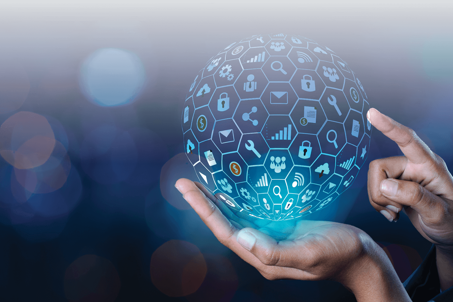 a person holding a sphere with icons on it