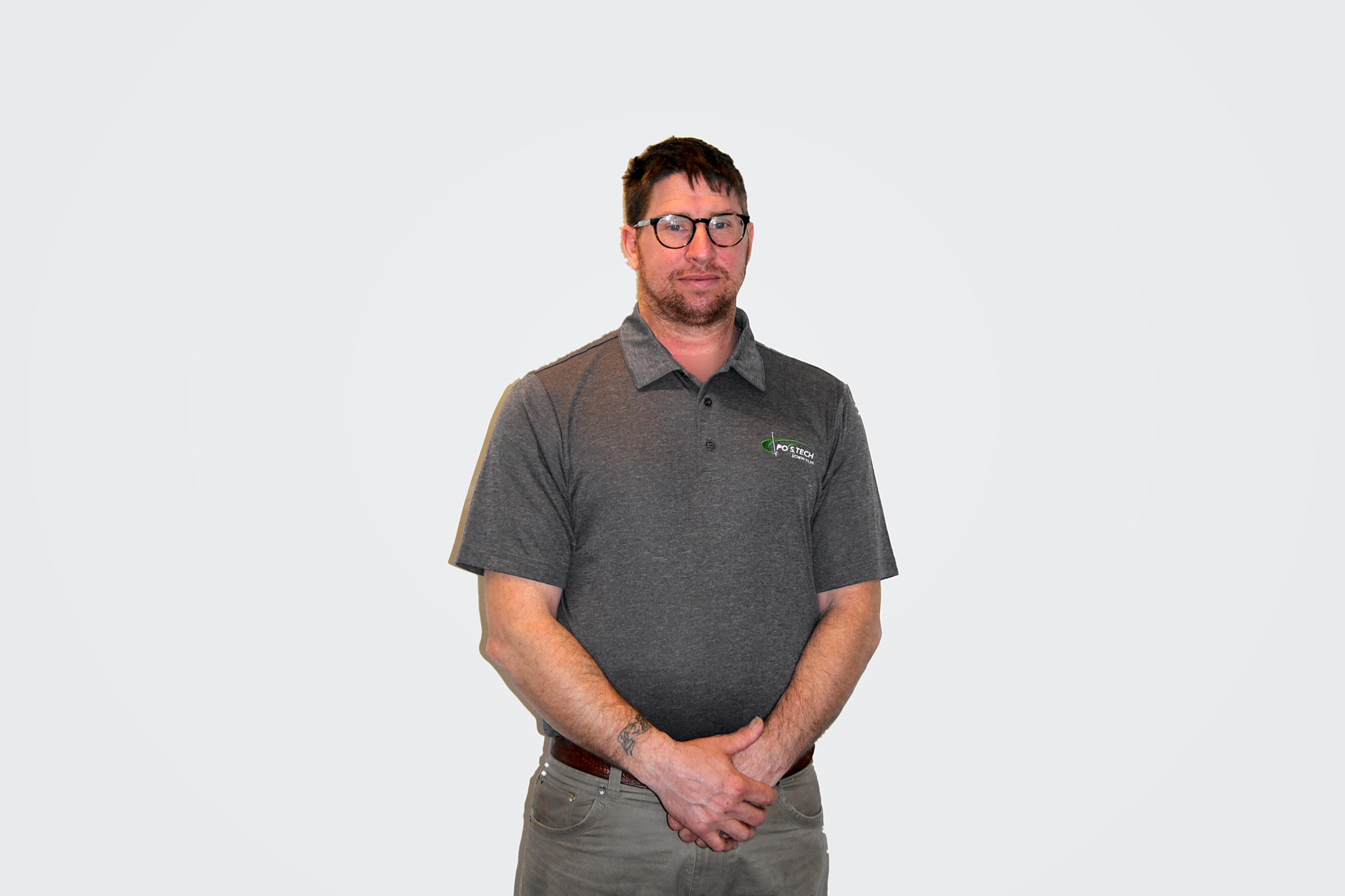 Michael Takach of Postech Screw Piles Lake Placid, NY, standing in a gray Postech polo shirt
