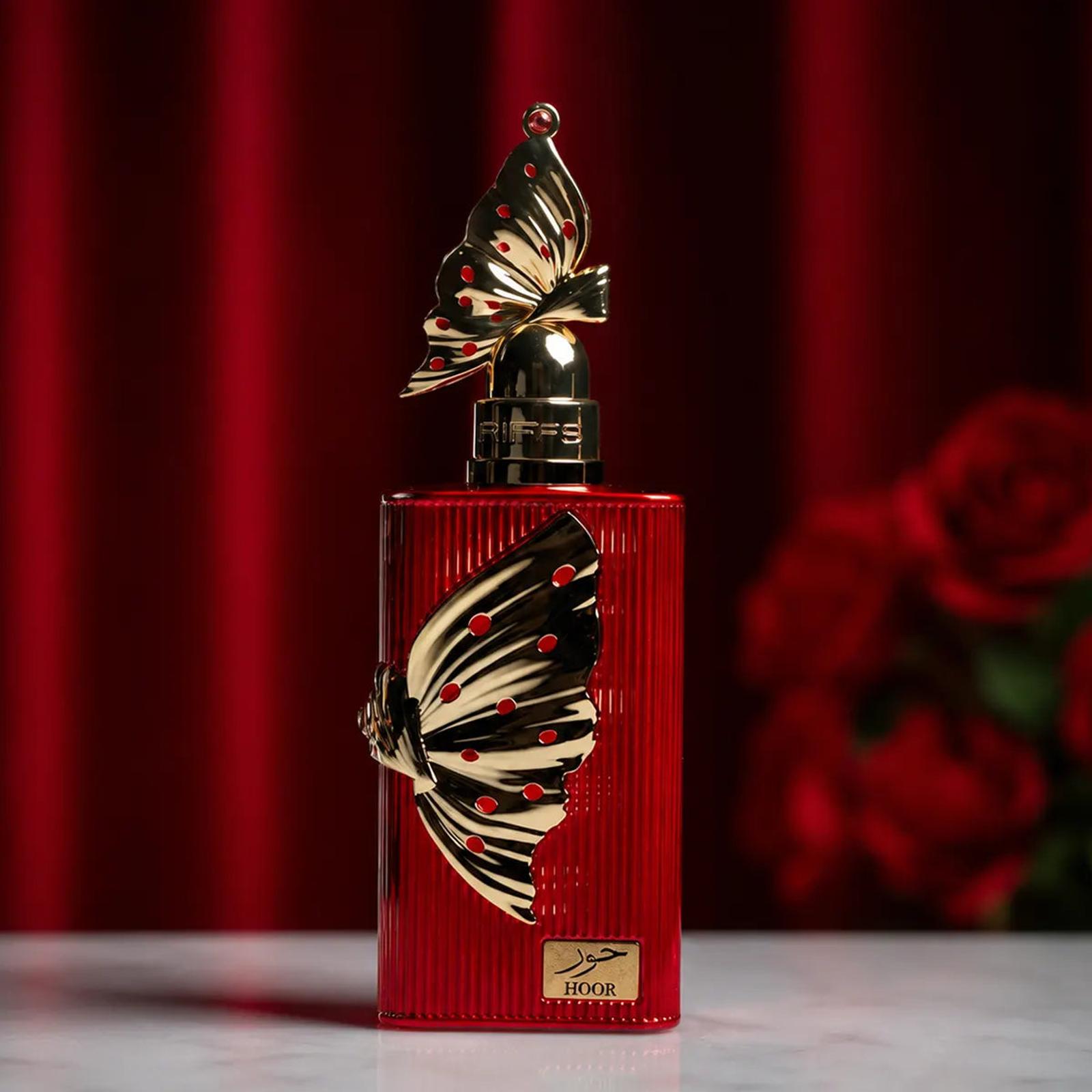 Riiffs Hoor 100ML perfume bottle beside red roses
