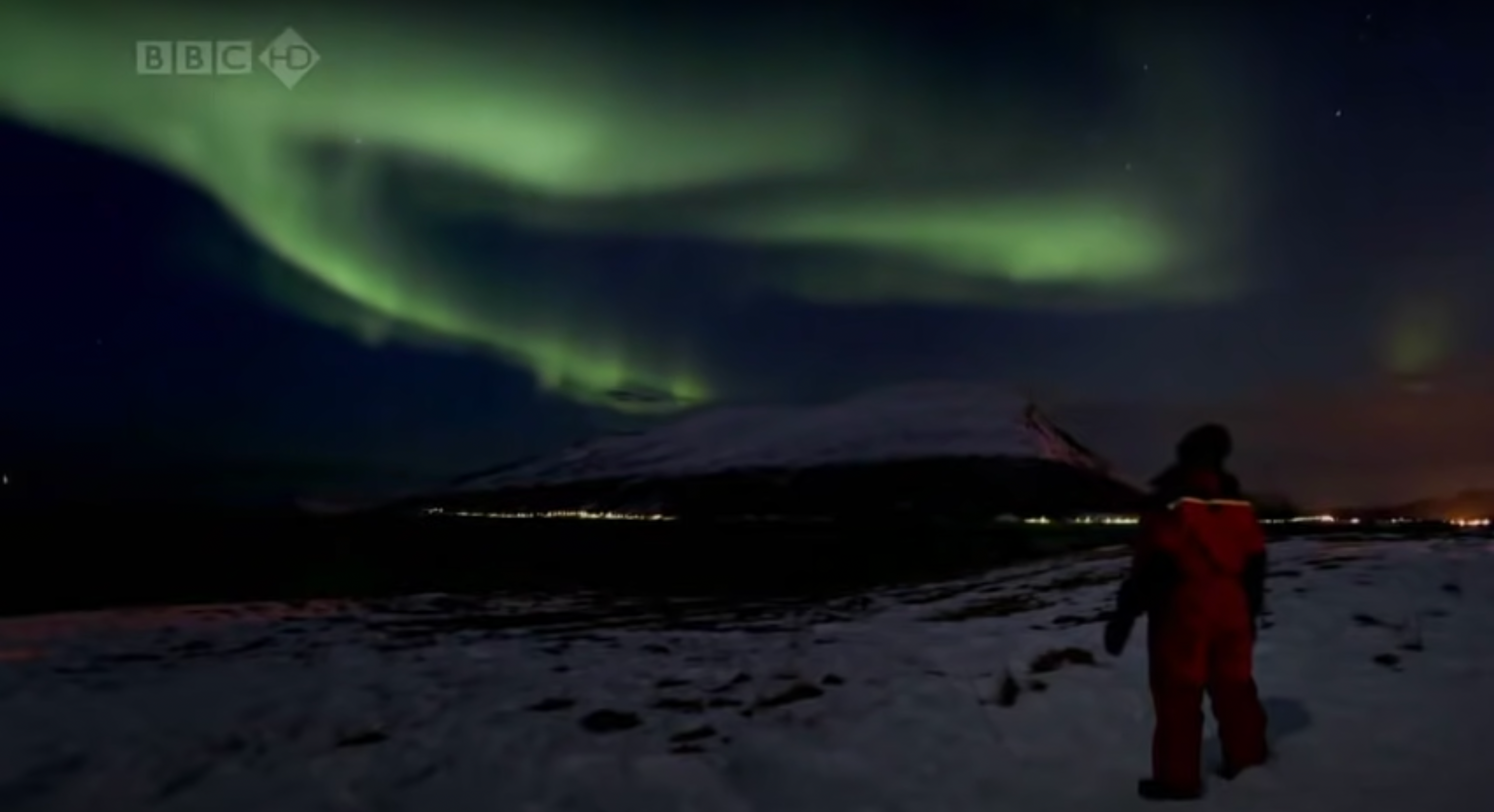 Joanna Lumley at the beach at Lyngen North seeing the northern lights above Uløya