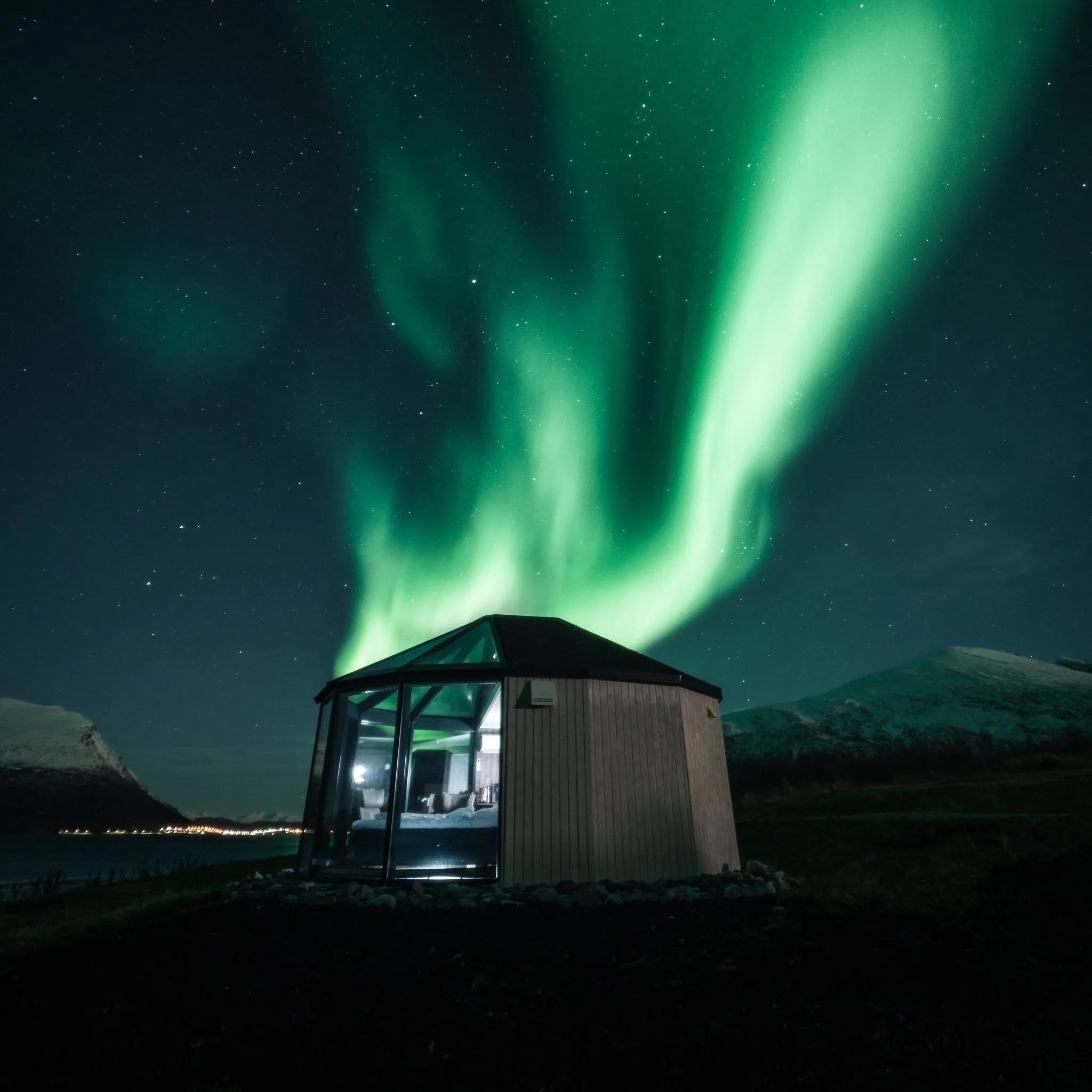 Glass igloo 180º under the northern lights at Lyngen North