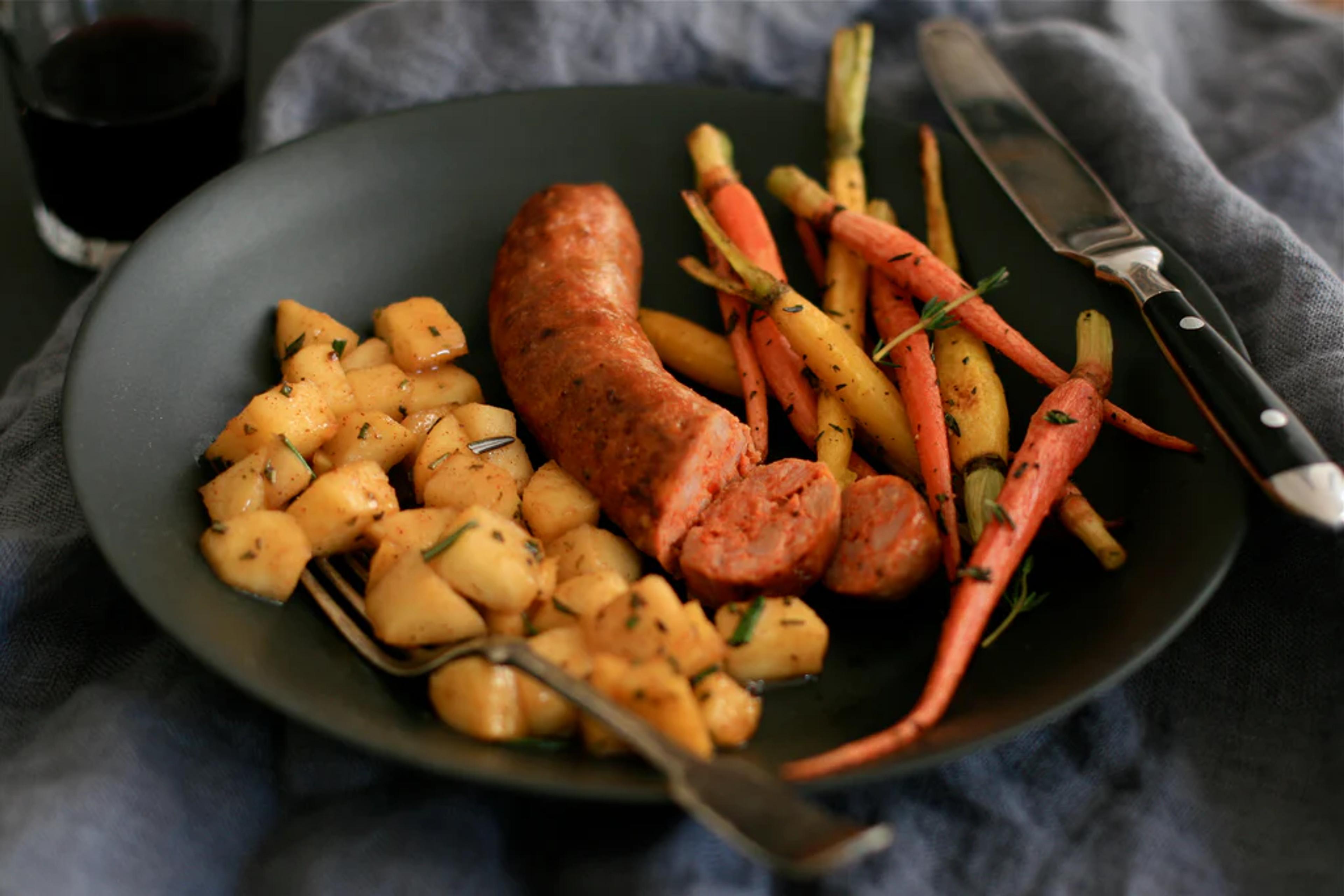 Grilled Sausages with Sautéed Apples and Roasted Carrots