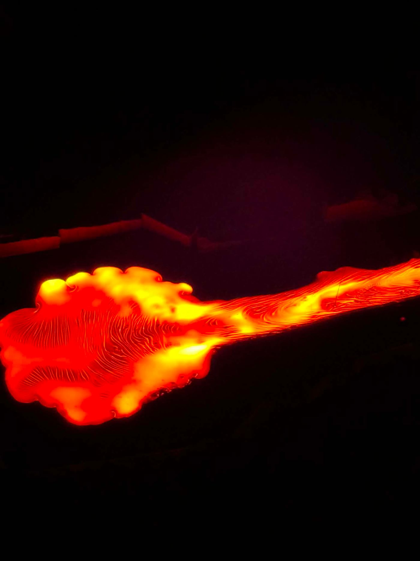 Glowing molten lava flowing during Lava Show Reykjavík