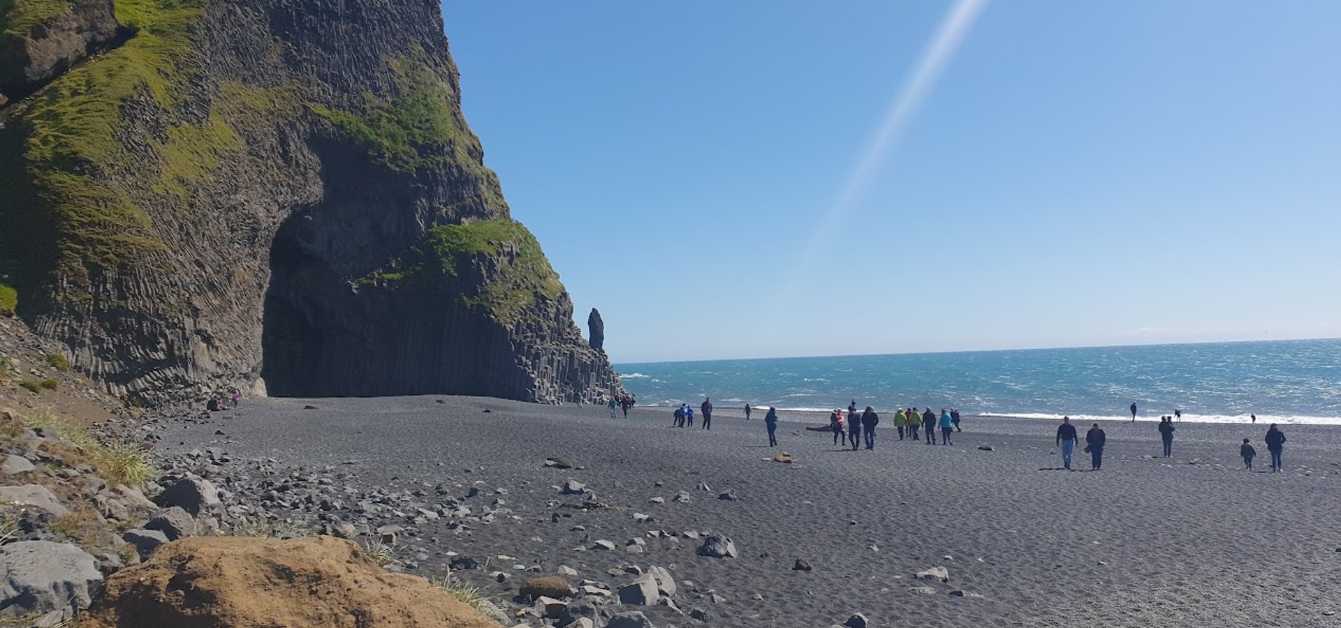 Reynisfjara black sand beach with basalt columns and sea stacks — Iceland