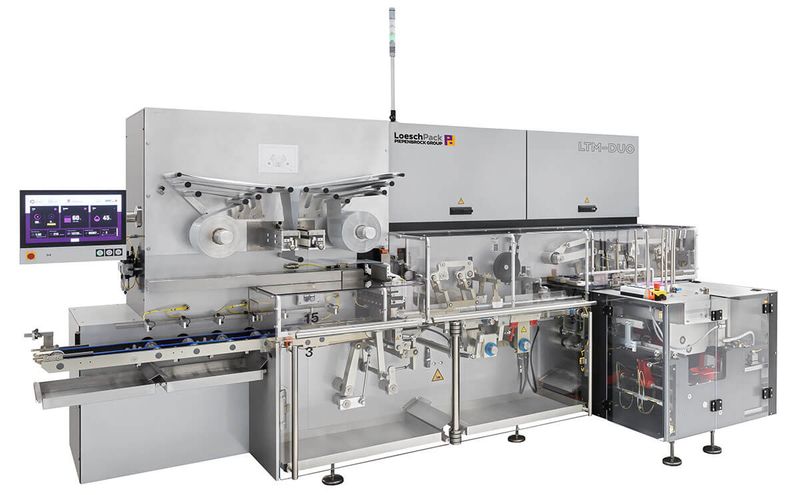 A LoeschPack LTM-DUO fold wrapping machine set up for chocolate tablets.