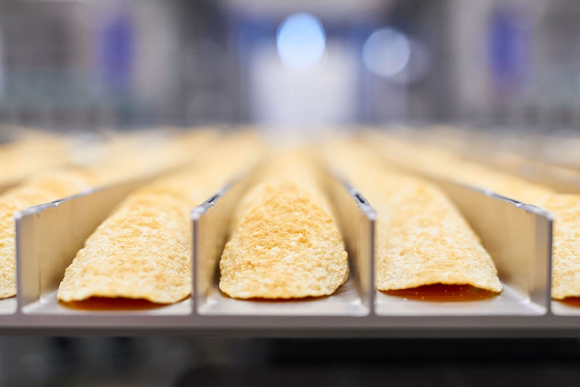 A complete Hastamat line running stackable chips through to finished cans.