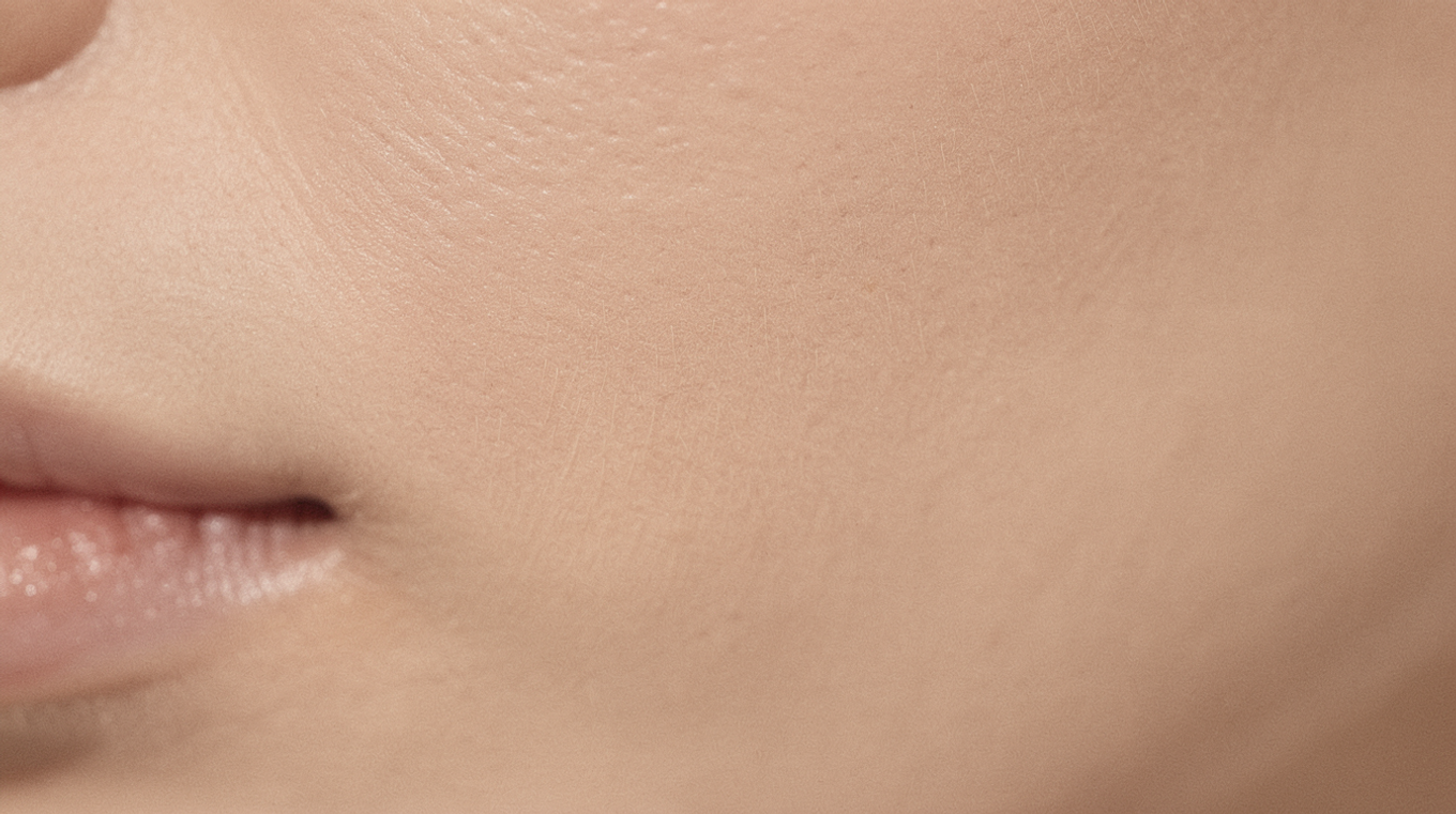 Close-up of calm, healthy skin texture - even and hydrated without redness