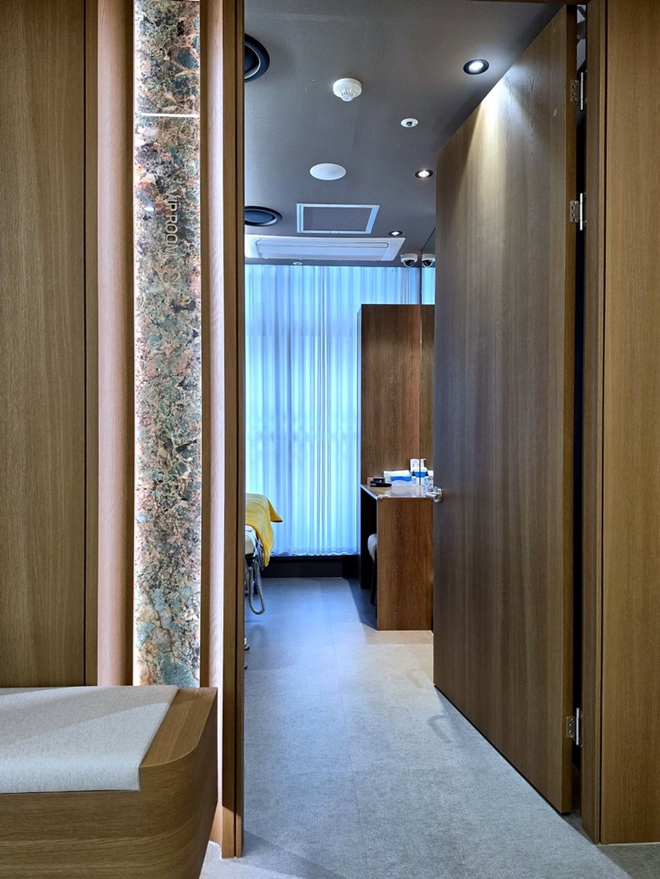 A calm and premium-looking entrance to a dermatology treatment room in Myeongdong - a good space to reassess treatment and care direction as seasons change