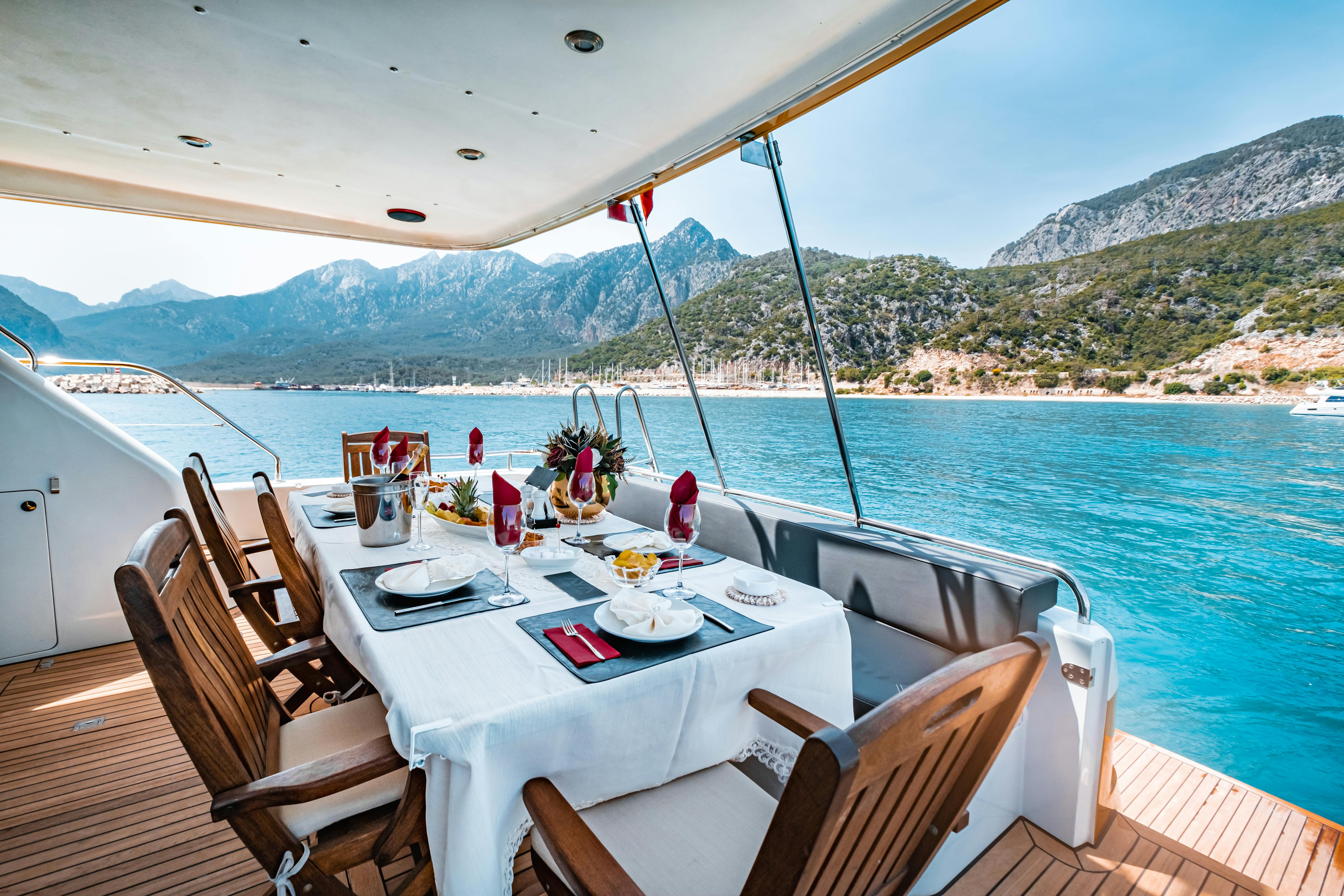 Crewed yacht anchored in a secluded bay in the Greek islands during a private summer charter