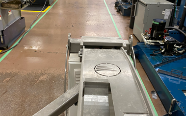 A damaged and worn factory floor in need of epoxy
