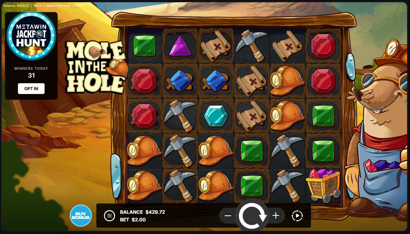 Mole in the Hole base game on MetaWin showing the 6x5 grid with gem and mining symbols, MetaWin Jackpot Hunt badge, and $2 bet