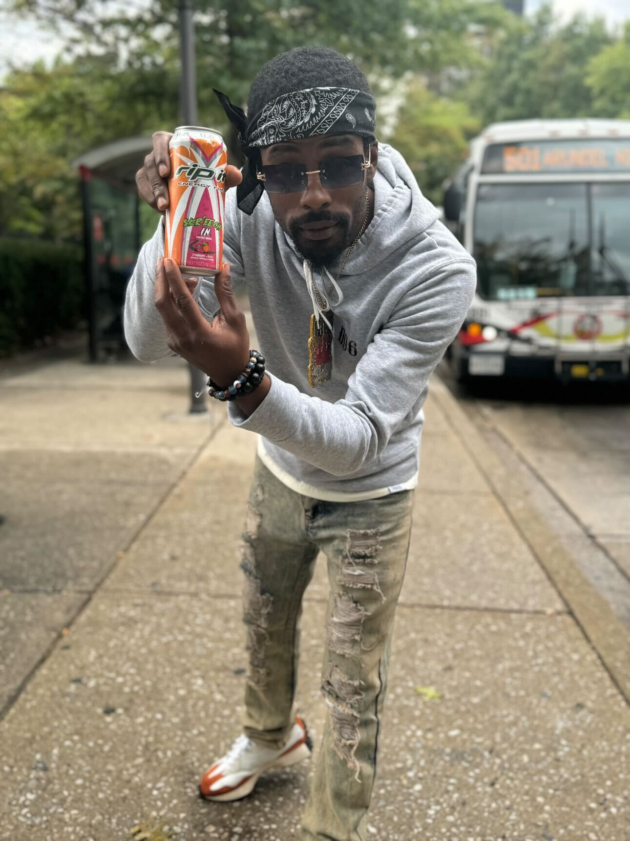 A man on the street posing with an energy drink can near a bus stop.​​​​‌﻿‍﻿​‍​‍‌‍﻿﻿‌﻿​‍‌‍‍‌‌‍‌﻿‌‍‍‌‌‍﻿‍​‍​‍​﻿‍‍​‍​‍‌﻿​﻿‌‍​‌‌‍﻿‍‌‍‍‌‌﻿‌​‌﻿‍‌​‍﻿‍‌‍‍‌‌‍﻿﻿​‍​‍​‍﻿​​‍​‍‌‍‍​‌﻿​‍‌‍‌‌‌‍‌‍​‍​‍​﻿‍‍​‍​‍‌‍‍​‌﻿‌​‌﻿‌​‌﻿​​‌﻿​﻿​﻿‍‍​‍﻿﻿​‍﻿﻿‌﻿‌﻿‌﻿‌﻿‌﻿‌﻿​‍﻿‍‌﻿​‍‌‍‍‌‌﻿​​‌‍‍‌‌﻿‌​‌‍‌‌‌‍﻿‍‌‍‌‌‌﻿​‍‌‍‌﻿‌﻿‍‌​‍﻿‍‌‍​﻿‌‍﻿﻿‌‍﻿‌​‍﻿﻿‌‍‍‌‌‍﻿‍‌﻿‌​‌‍‌‌‌‍﻿‍‌﻿‌​​‍﻿﻿‌‍‌‌‌‍‌​‌‍‍‌‌﻿‌​​‍﻿﻿‌‍﻿‌‌‍﻿﻿‌‍‌​‌‍‌‌​﻿﻿‌‌﻿​​‌﻿​‍‌‍‌‌‌﻿​﻿‌‍‌‌‌‍﻿‍‌﻿‌​‌‍​‌‌﻿‌​‌‍‍‌‌‍﻿﻿‌‍﻿‍​﻿‍﻿‌‍‍‌‌‍‌​​﻿﻿‌‌‍​‌​﻿‌​​﻿​‍‌‍​‌​﻿‌﻿​﻿​​​﻿‍​​﻿‌‌​‍﻿‌​﻿​﻿​﻿‌‌​﻿​​​﻿​‍​‍﻿‌​﻿‌​​﻿​​​﻿‌​​﻿​‍​‍﻿‌‌‍​‌‌‍​‌‌‍‌‌‌‍‌‍​‍﻿‌​﻿​​​﻿​‌‌‍​‍‌‍‌‌​﻿​﻿​﻿‌​​﻿‍‌​﻿‌​‌‍​﻿​﻿‍​‌‍‌‍‌‍‌​​﻿‍﻿‌﻿‌​‌﻿‍‌‌﻿​​‌‍‌‌​﻿﻿‌‌‍﻿‌‌‍﻿﻿‌‍‌​‌﻿‌‌‌‍﻿​‌‍‌‌​﻿‍﻿‌﻿​​‌‍​‌‌﻿‌​‌‍‍​​﻿﻿‌‌‍​﻿‌‍​‌‌﻿​‍‌‍‌​‌‌​﻿‌‍​﻿‌﻿​‍‌‍﻿﻿‌‍﻿​‌‍﻿​​‍﻿‍‌‍​‍‌‍﻿﻿‌﻿‌​‌﻿‌​‌‍﻿﻿‌‍﻿‌‌‌﻿﻿‌﻿​﻿‌‍​﻿‌﻿​‍‌‍﻿﻿‌‍﻿​‌‍﻿​​‍‌‌​﻿‌‌‌​​‍‌‌﻿﻿‌‍‍﻿‌‍‌‌‌﻿‍‌​‍‌‌​﻿​﻿‌​‌​​‍‌‌​﻿​﻿‌​‌​​‍‌‌​﻿​‍​﻿​‍​﻿‌‌​﻿​‍‌‍‌​​﻿‍​​﻿​​​﻿​﻿‌‍​﻿‌‍​﻿‌‍​﻿​﻿​﻿​﻿‌​​﻿​​​‍‌‌​﻿​‍​﻿​‍​‍‌‌​﻿‌‌‌​‌​​‍﻿‍‌‍‍‌‌‍﻿‌‌‍​‌‌‍‌﻿‌‍‌‌​‍﻿‍‌‍​‌‌‍﻿​‌﻿‌​​﻿﻿﻿‌‍​‍‌‍​‌‌﻿​﻿‌‍‌‌‌‌‌‌‌﻿​‍‌‍﻿​​﻿﻿‌‌‍‍​‌﻿‌​‌﻿‌​‌﻿​​‌﻿​﻿​‍‌‌​﻿​﻿‌​​‌​‍‌‌​﻿​‍‌​‌‍​‍‌‌​﻿​‍‌​‌‍‌﻿‌﻿‌﻿‌﻿‌﻿‌﻿​‍﻿‍‌﻿​‍‌‍‍‌‌﻿​​‌‍‍‌‌﻿‌​‌‍‌‌‌‍﻿‍‌‍‌‌‌﻿​‍‌‍‌﻿‌﻿‍‌​‍﻿‍‌‍​﻿‌‍﻿﻿‌‍﻿‌​‍‌‍‌‍‍‌‌‍‌​​﻿﻿‌‌‍​‌​﻿‌​​﻿​‍‌‍​‌​﻿‌﻿​﻿​​​﻿‍​​﻿‌‌​‍﻿‌​﻿​﻿​﻿‌‌​﻿​​​﻿​‍​‍﻿‌​﻿‌​​﻿​​​﻿‌​​﻿​‍​‍﻿‌‌‍​‌‌‍​‌‌‍‌‌‌‍‌‍​‍﻿‌​﻿​​​﻿​‌‌‍​‍‌‍‌‌​﻿​﻿​﻿‌​​﻿‍‌​﻿‌​‌‍​﻿​﻿‍​‌‍‌‍‌‍‌​​‍‌‍‌﻿‌​‌﻿‍‌‌﻿​​‌‍‌‌​﻿﻿‌‌‍﻿‌‌‍﻿﻿‌‍‌​‌﻿‌‌‌‍﻿​‌‍‌‌​‍‌‍‌﻿​​‌‍​‌‌﻿‌​‌‍‍​​﻿﻿‌‌‍​﻿‌‍​‌‌﻿​‍‌‍‌​‌‌​﻿‌‍​﻿‌﻿​‍‌‍﻿﻿‌‍﻿​‌‍﻿​​‍﻿‍‌‍​‍‌‍﻿﻿‌﻿‌​‌﻿‌​‌‍﻿﻿‌‍﻿‌‌‌﻿﻿‌﻿​﻿‌‍​﻿‌﻿​‍‌‍﻿﻿‌‍﻿​‌‍﻿​​‍‌‌​﻿‌‌‌​​‍‌‌﻿﻿‌‍‍﻿‌‍‌‌‌﻿‍‌​‍‌‌​﻿​﻿‌​‌​​‍‌‌​﻿​﻿‌​‌​​‍‌‌​﻿​‍​﻿​‍​﻿‌‌​﻿​‍‌‍‌​​﻿‍​​﻿​​​﻿​﻿‌‍​﻿‌‍​﻿‌‍​﻿​﻿​﻿​﻿‌​​﻿​​​‍‌‌​﻿​‍​﻿​‍​‍‌‌​﻿‌‌‌​‌​​‍﻿‍‌‍‍‌‌‍﻿‌‌‍​‌‌‍‌﻿‌‍‌‌​‍﻿‍‌‍​‌‌‍﻿​‌﻿‌​​‍​‍‌﻿﻿‌