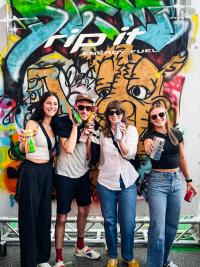 Four people smiling and holding energy drink cans in front of a colorful graffiti backdrop.​​​​‌﻿‍﻿​‍​‍‌‍﻿﻿‌﻿​‍‌‍‍‌‌‍‌﻿‌‍‍‌‌‍﻿‍​‍​‍​﻿‍‍​‍​‍‌﻿​﻿‌‍​‌‌‍﻿‍‌‍‍‌‌﻿‌​‌﻿‍‌​‍﻿‍‌‍‍‌‌‍﻿﻿​‍​‍​‍﻿​​‍​‍‌‍‍​‌﻿​‍‌‍‌‌‌‍‌‍​‍​‍​﻿‍‍​‍​‍‌‍‍​‌﻿‌​‌﻿‌​‌﻿​​‌﻿​﻿​﻿‍‍​‍﻿﻿​‍﻿﻿‌﻿‌﻿‌﻿‌﻿‌﻿‌﻿​‍﻿‍‌﻿​‍‌‍‍‌‌﻿​​‌‍‍‌‌﻿‌​‌‍‌‌‌‍﻿‍‌‍‌‌‌﻿​‍‌‍‌﻿‌﻿‍‌​‍﻿‍‌‍​﻿‌‍﻿﻿‌‍﻿‌​‍﻿﻿‌‍‍‌‌‍﻿‍‌﻿‌​‌‍‌‌‌‍﻿‍‌﻿‌​​‍﻿﻿‌‍‌‌‌‍‌​‌‍‍‌‌﻿‌​​‍﻿﻿‌‍﻿‌‌‍﻿﻿‌‍‌​‌‍‌‌​﻿﻿‌‌﻿​​‌﻿​‍‌‍‌‌‌﻿​﻿‌‍‌‌‌‍﻿‍‌﻿‌​‌‍​‌‌﻿‌​‌‍‍‌‌‍﻿﻿‌‍﻿‍​﻿‍﻿‌‍‍‌‌‍‌​​﻿﻿‌‌﻿​​‌﻿​‍‌‍﻿﻿‌‍‌​‌﻿‌‌‌‍​﻿‌﻿‌​‌‌‌​‌‍‌‌‌‍﻿‌‌﻿​​‌‍﻿​‌‍​‌‌﻿‌​‌‍‌‌​﻿‍﻿‌﻿‌​‌﻿‍‌‌﻿​​‌‍‌‌​﻿﻿‌‌﻿​​‌﻿​‍‌‍﻿﻿‌‍‌​‌﻿‌‌‌‍​﻿‌﻿‌​‌‌‌​‌‍‌‌‌‍﻿‌‌﻿​​‌‍﻿​‌‍​‌‌﻿‌​‌‍‌‌​﻿‍﻿‌﻿​​‌‍​‌‌﻿‌​‌‍‍​​﻿﻿‌‌‍‍‌‌‍﻿‌‌‍​‌‌‍‌﻿‌‍‌‌‌﻿​﻿‌‌﻿﻿‌﻿​‍‌‍‍‌‌‍‌﻿‌‍‍​‌﻿‌​​‍‌‌​﻿‌‌‌​​‍‌‌﻿﻿‌‍‍﻿‌‍‌‌‌﻿‍‌​‍‌‌​﻿​﻿‌​‌​​‍‌‌​﻿​﻿‌​‌​​‍‌‌​﻿​‍​﻿​‍‌‍‌‌​﻿‌﻿‌‍‌​​﻿‍​​﻿‌​‌‍​‌‌‍‌​‌‍​‌‌‍​﻿‌‍​‍​﻿​‍​﻿‌‍​‍‌‌​﻿​‍​﻿​‍​‍‌‌​﻿‌‌‌​‌​​‍﻿‍‌‍‍‌‌‍﻿‌‌‍​‌‌‍‌﻿‌‍‌‌​‍﻿‍‌‍​‌‌‍﻿​‌﻿‌​​﻿﻿﻿‌‍​‍‌‍​‌‌﻿​﻿‌‍‌‌‌‌‌‌‌﻿​‍‌‍﻿​​﻿﻿‌‌‍‍​‌﻿‌​‌﻿‌​‌﻿​​‌﻿​﻿​‍‌‌​﻿​﻿‌​​‌​‍‌‌​﻿​‍‌​‌‍​‍‌‌​﻿​‍‌​‌‍‌﻿‌﻿‌﻿‌﻿‌﻿‌﻿​‍﻿‍‌﻿​‍‌‍‍‌‌﻿​​‌‍‍‌‌﻿‌​‌‍‌‌‌‍﻿‍‌‍‌‌‌﻿​‍‌‍‌﻿‌﻿‍‌​‍﻿‍‌‍​﻿‌‍﻿﻿‌‍﻿‌​‍‌‍‌‍‍‌‌‍‌​​﻿﻿‌‌﻿​​‌﻿​‍‌‍﻿﻿‌‍‌​‌﻿‌‌‌‍​﻿‌﻿‌​‌‌‌​‌‍‌‌‌‍﻿‌‌﻿​​‌‍﻿​‌‍​‌‌﻿‌​‌‍‌‌​‍‌‍‌﻿‌​‌﻿‍‌‌﻿​​‌‍‌‌​﻿﻿‌‌﻿​​‌﻿​‍‌‍﻿﻿‌‍‌​‌﻿‌‌‌‍​﻿‌﻿‌​‌‌‌​‌‍‌‌‌‍﻿‌‌﻿​​‌‍﻿​‌‍​‌‌﻿‌​‌‍‌‌​‍‌‍‌﻿​​‌‍​‌‌﻿‌​‌‍‍​​﻿﻿‌‌‍‍‌‌‍﻿‌‌‍​‌‌‍‌﻿‌‍‌‌‌﻿​﻿‌‌﻿﻿‌﻿​‍‌‍‍‌‌‍‌﻿‌‍‍​‌﻿‌​​‍‌‌​﻿‌‌‌​​‍‌‌﻿﻿‌‍‍﻿‌‍‌‌‌﻿‍‌​‍‌‌​﻿​﻿‌​‌​​‍‌‌​﻿​﻿‌​‌​​‍‌‌​﻿​‍​﻿​‍‌‍‌‌​﻿‌﻿‌‍‌​​﻿‍​​﻿‌​‌‍​‌‌‍‌​‌‍​‌‌‍​﻿‌‍​‍​﻿​‍​﻿‌‍​‍‌‌​﻿​‍​﻿​‍​‍‌‌​﻿‌‌‌​‌​​‍﻿‍‌‍‍‌‌‍﻿‌‌‍​‌‌‍‌﻿‌‍‌‌​‍﻿‍‌‍​‌‌‍﻿​‌﻿‌​​‍​‍‌﻿﻿‌