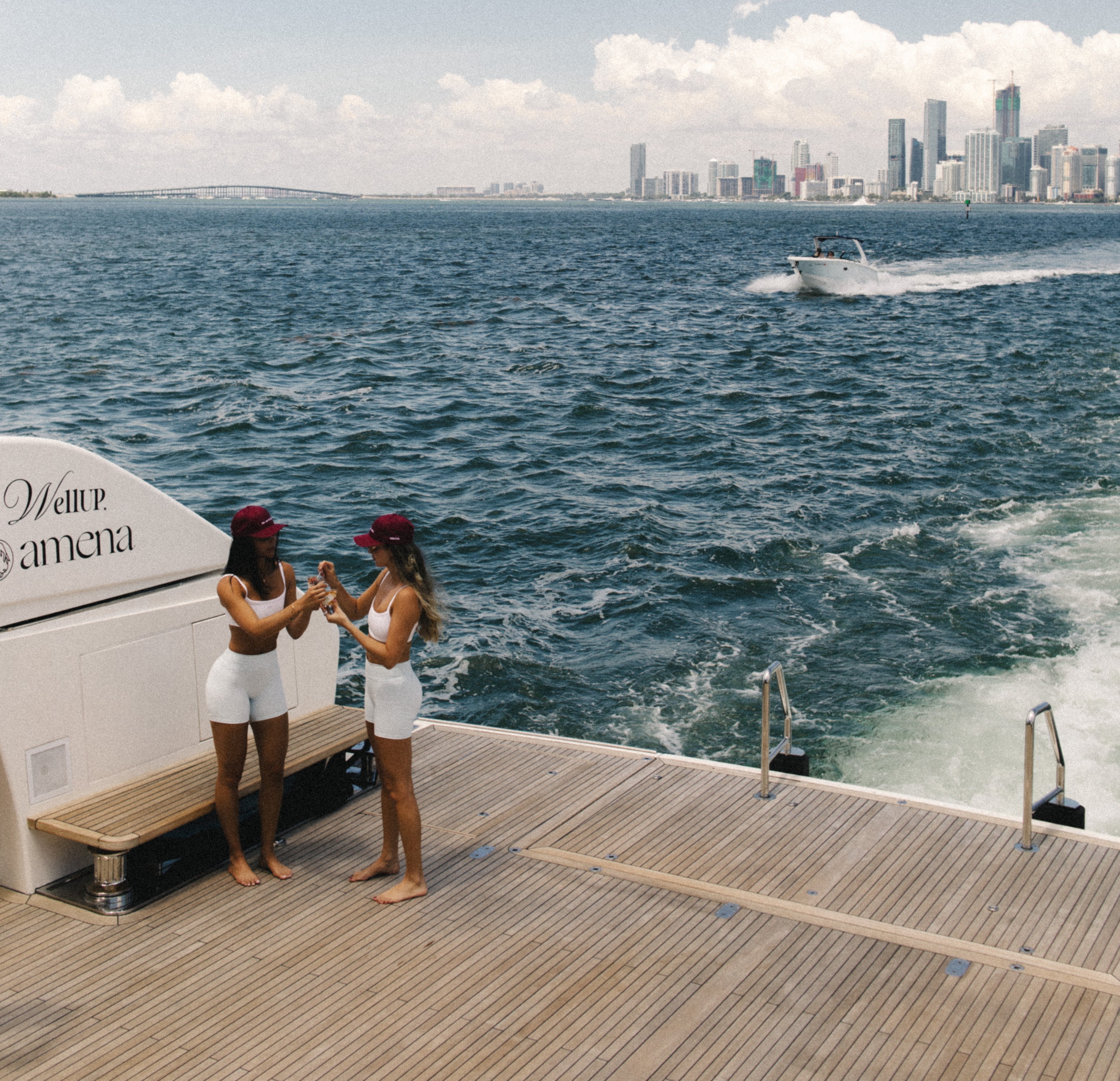 112-foot luxury yacht anchored along a sunlit Caribbean coastline