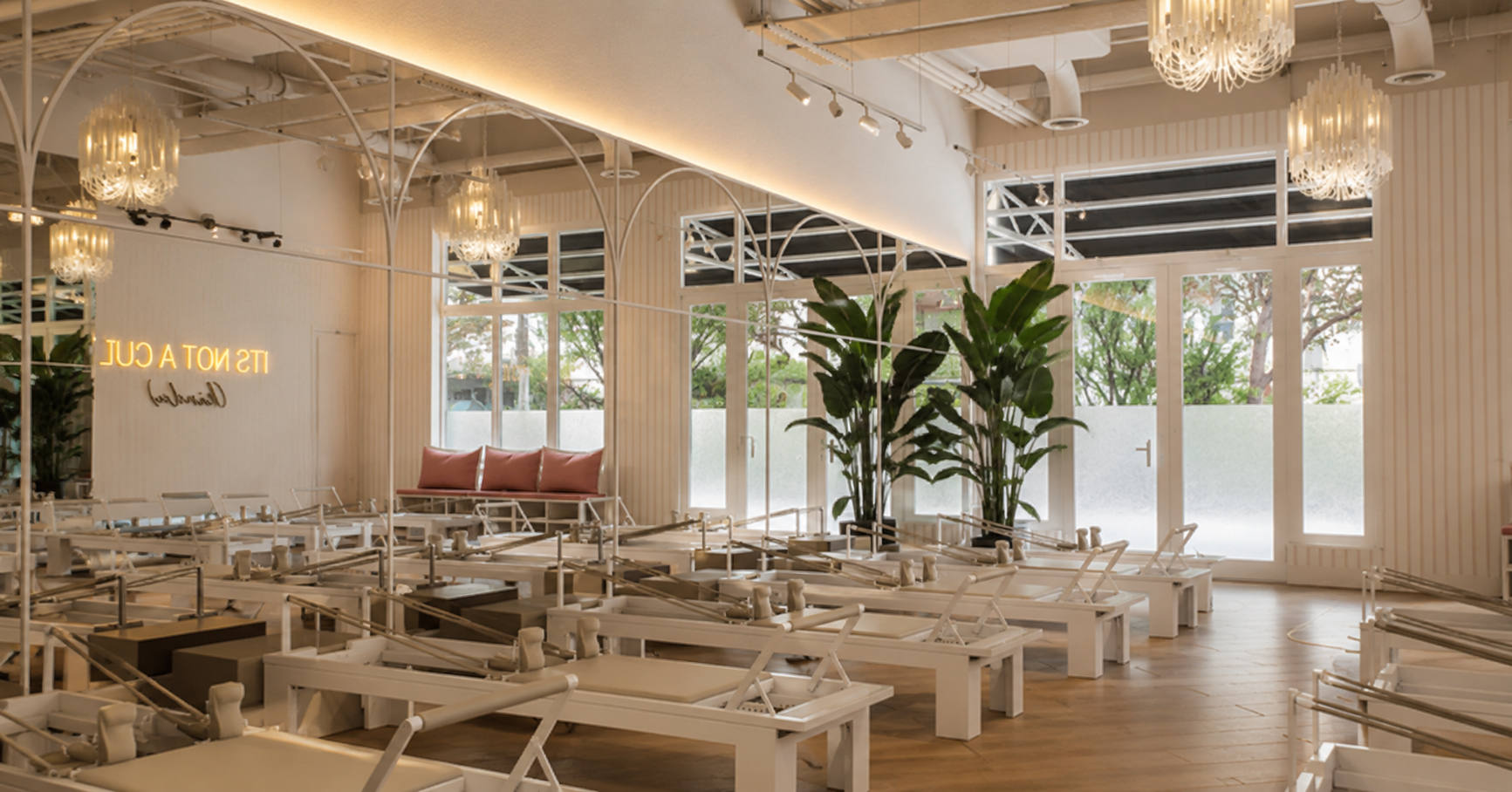 Official rendering of the Reforming Pilates Brickell studio, with reformers and arched mirrors