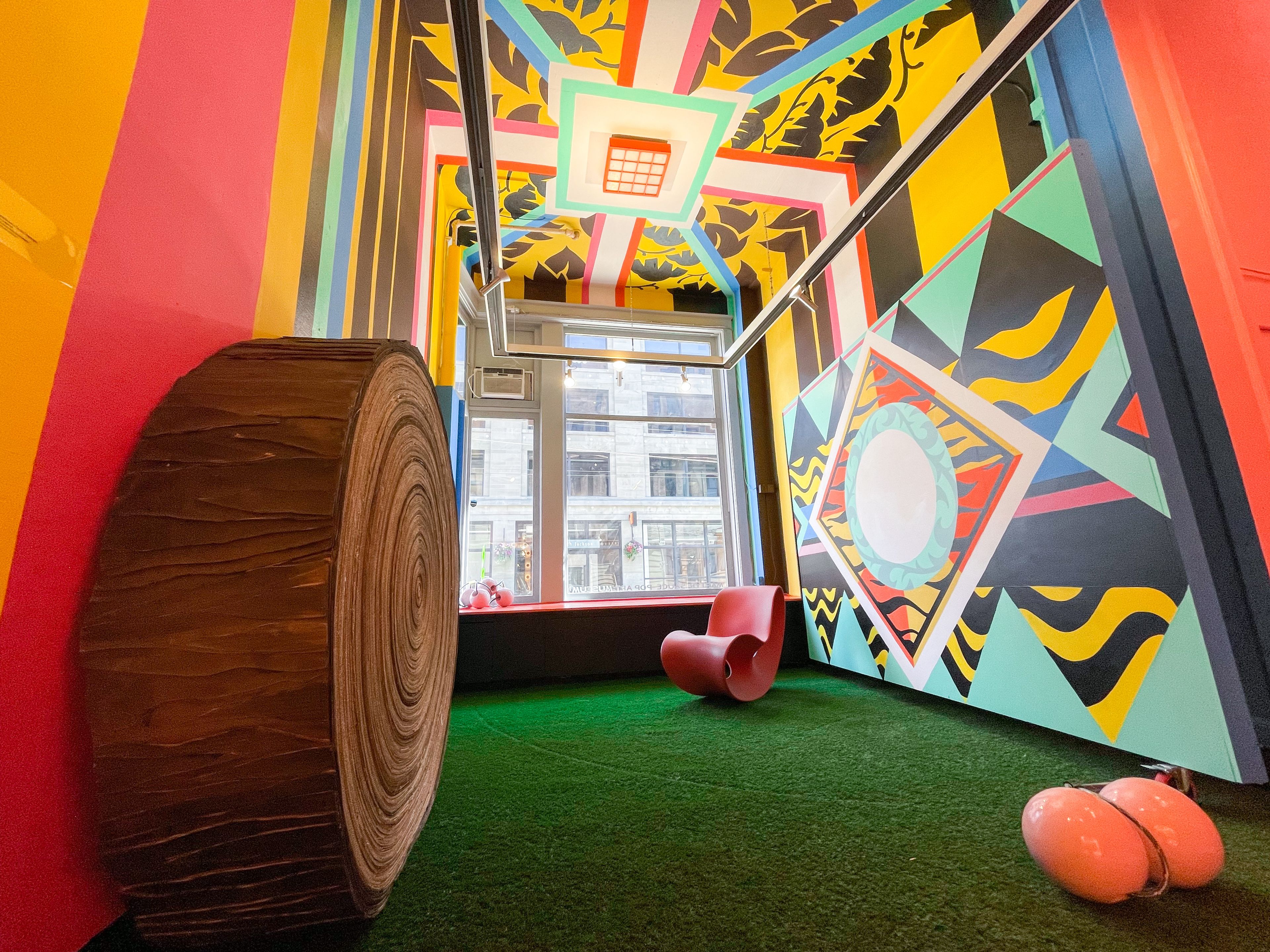 interior space with grass and colorful walls