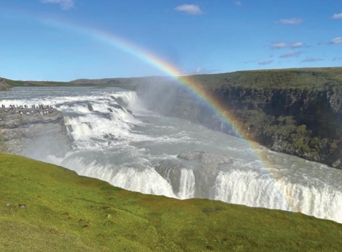 Rainbow above waterfall