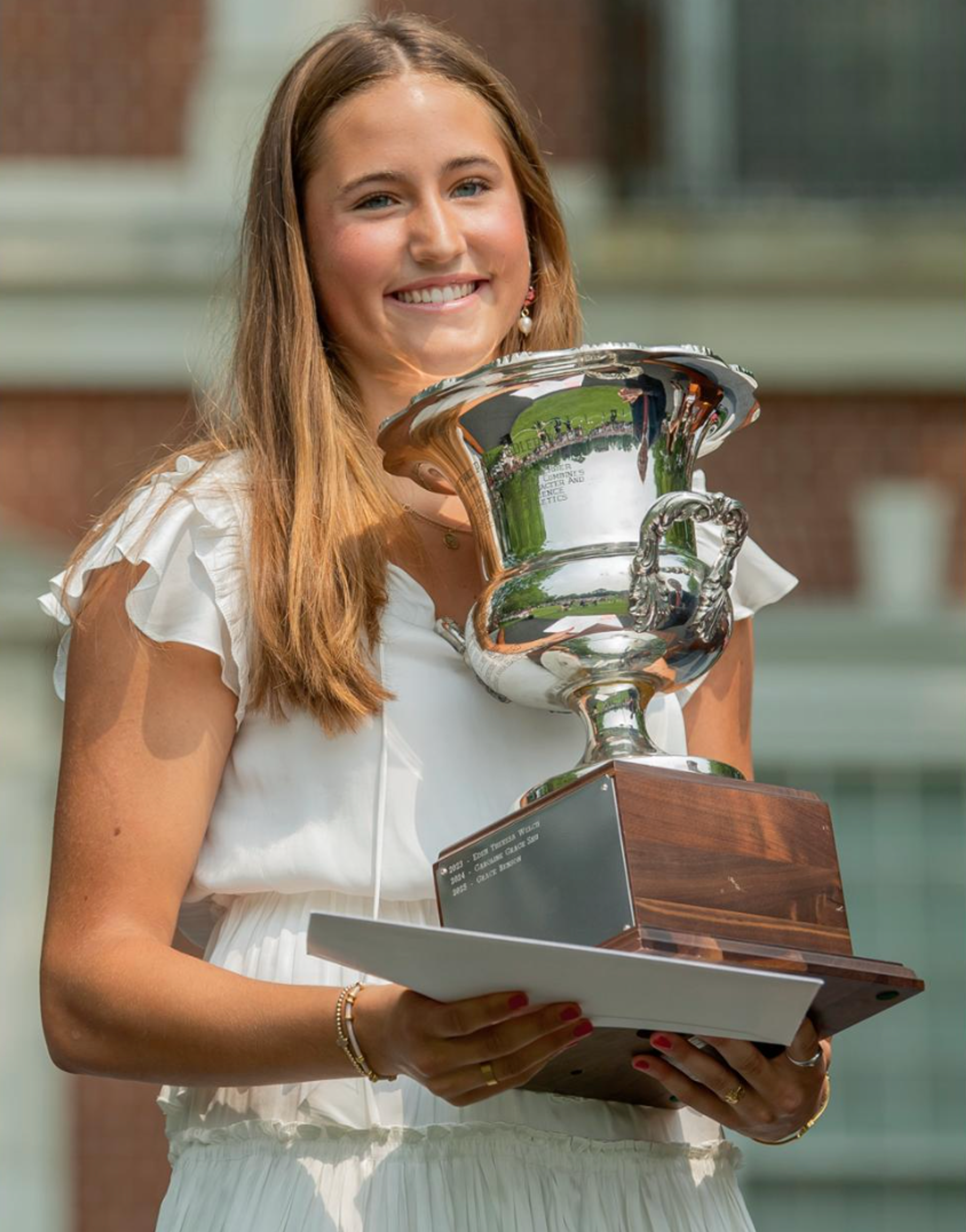 person holding award