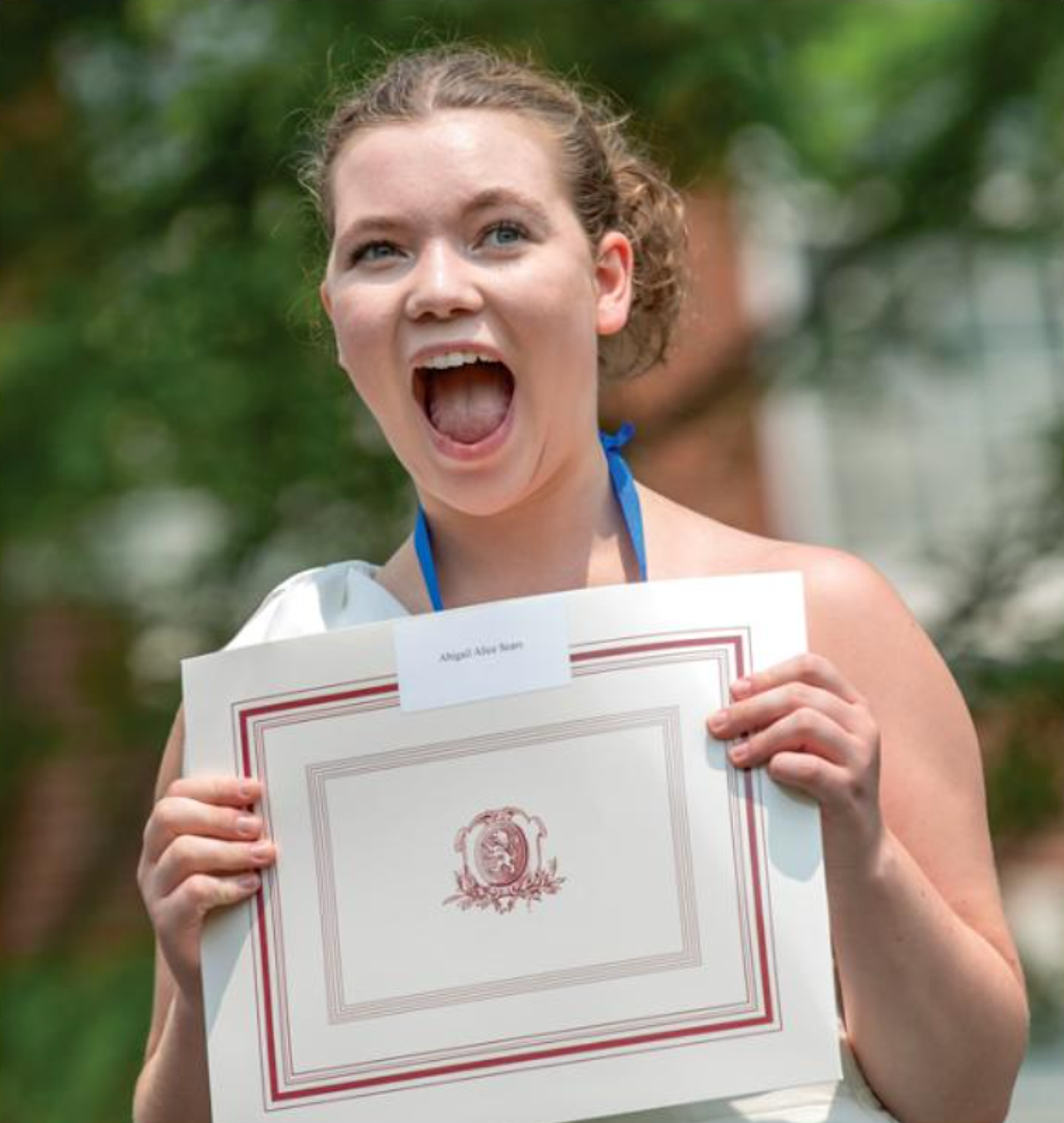 girl holding diploma