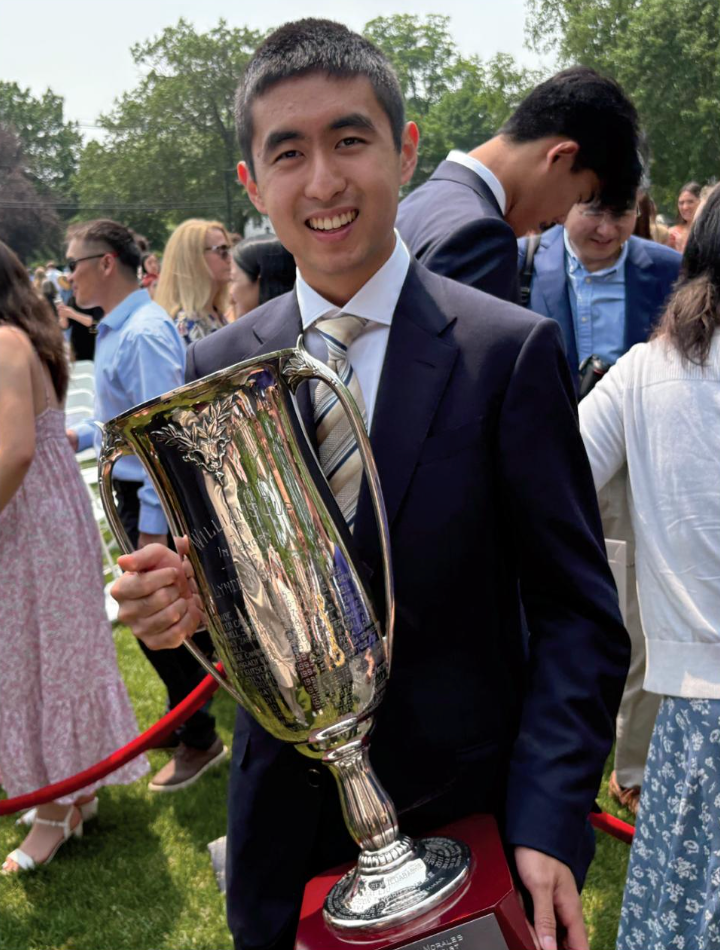 person holding award