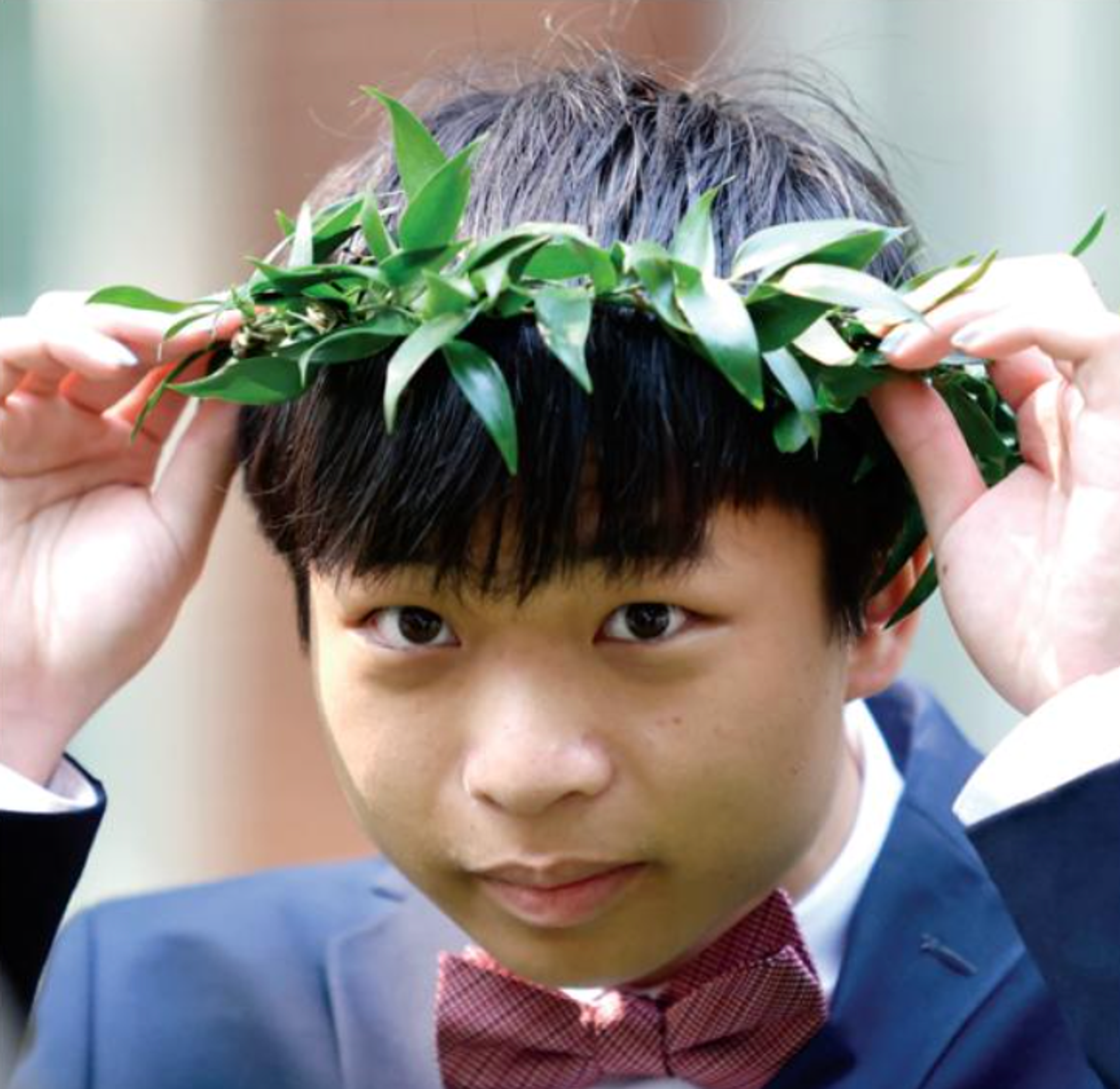 person adjusting head wreath