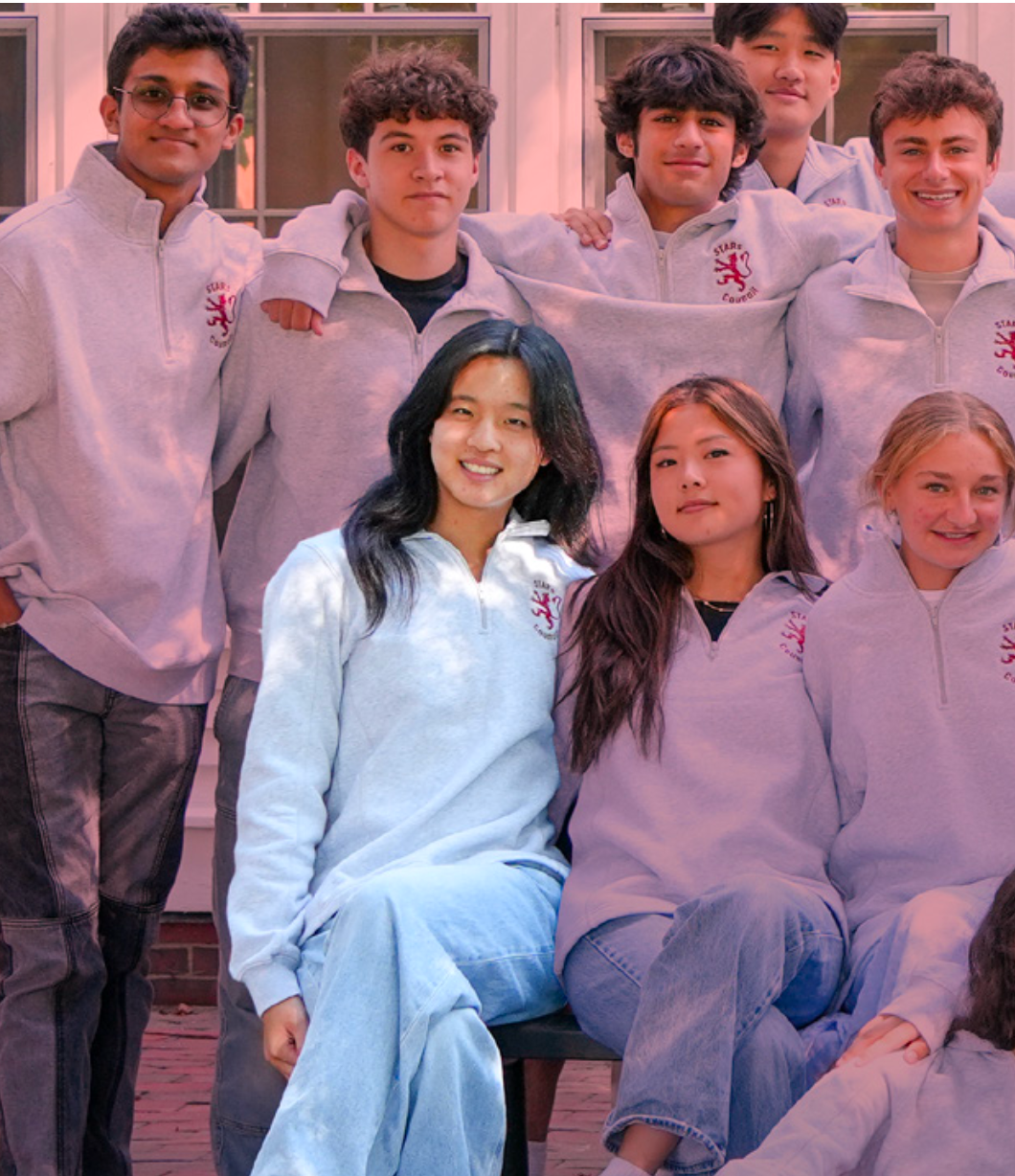 Students gathered smiling. 