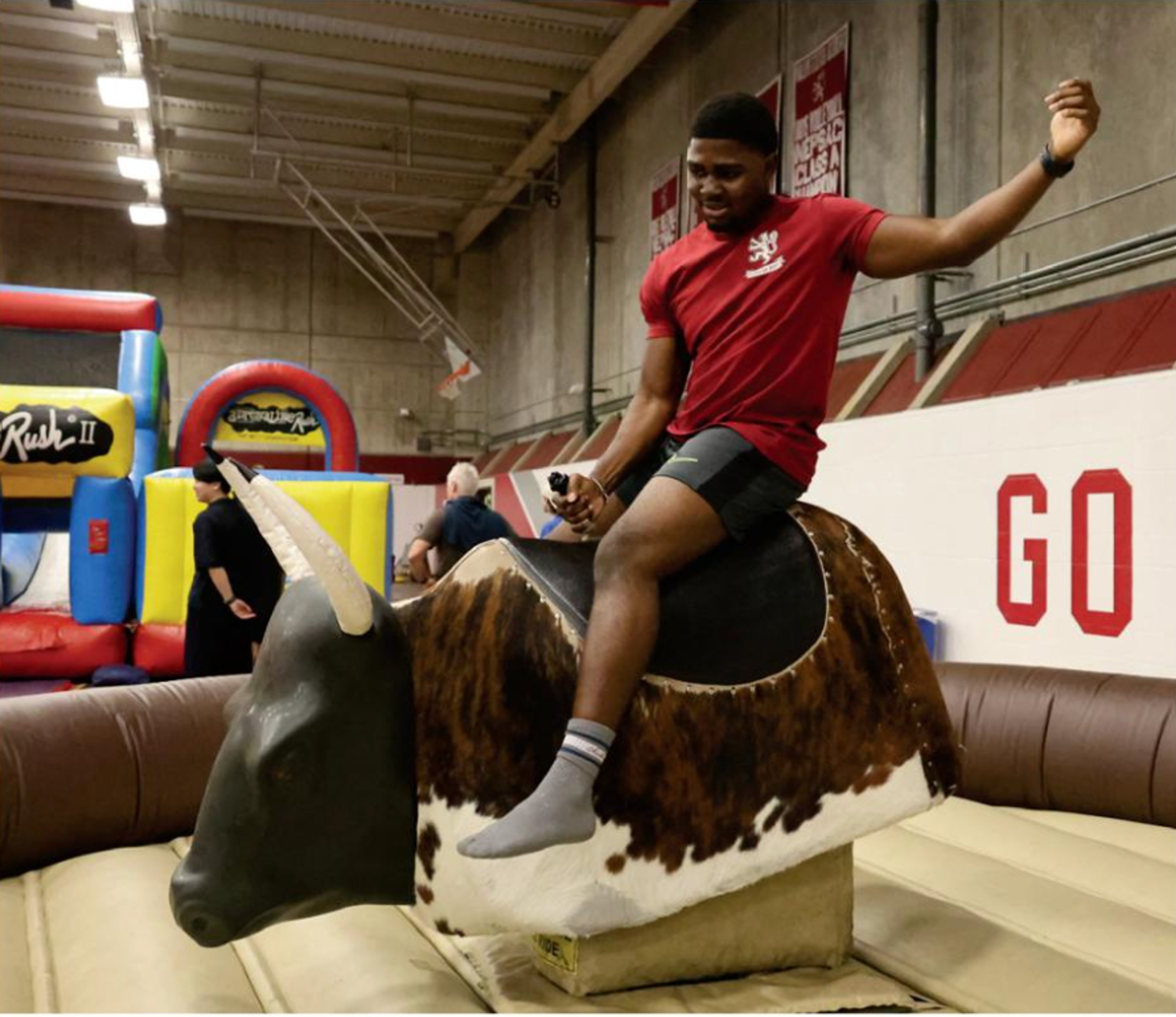 kid riding a electronic bull