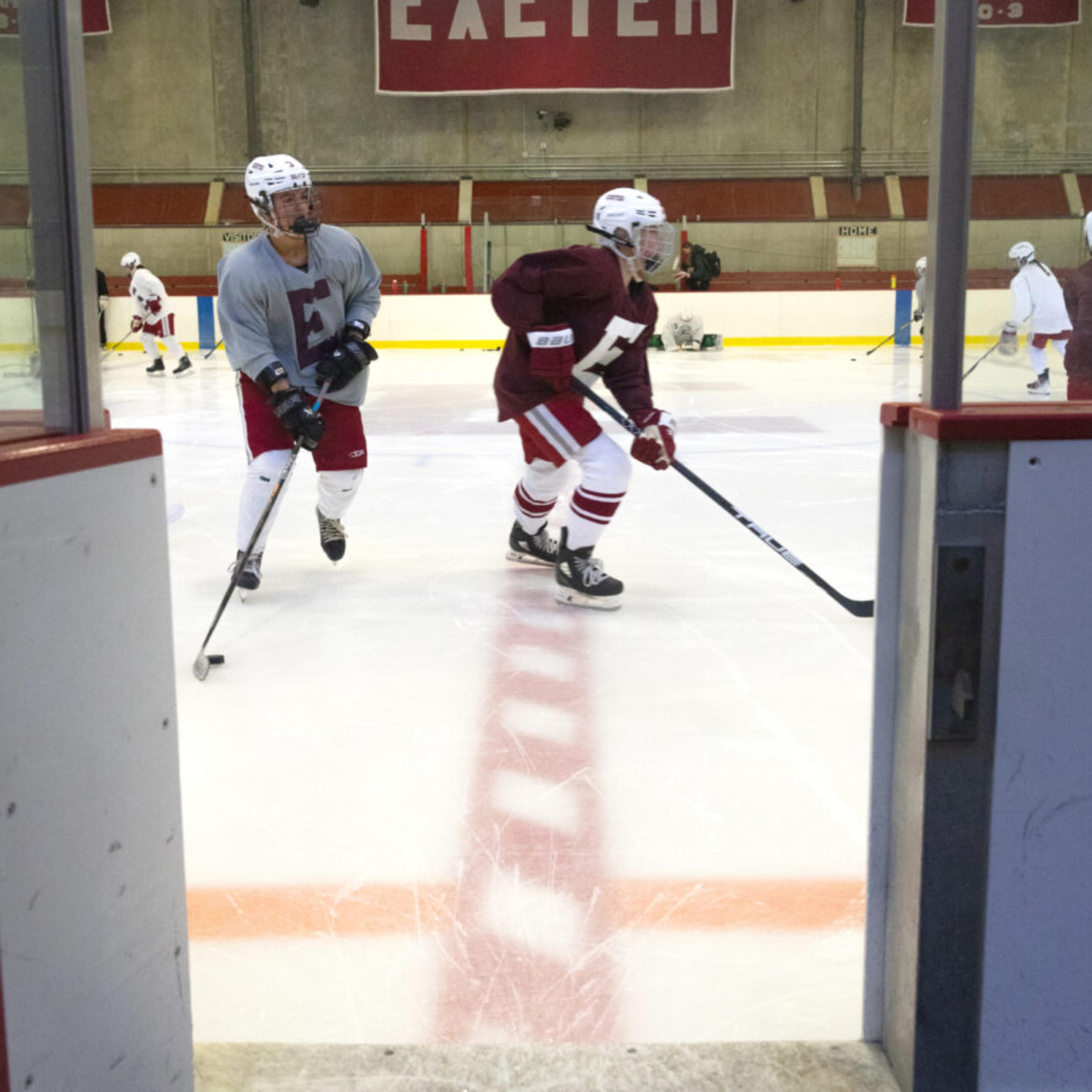 Hockey players skating