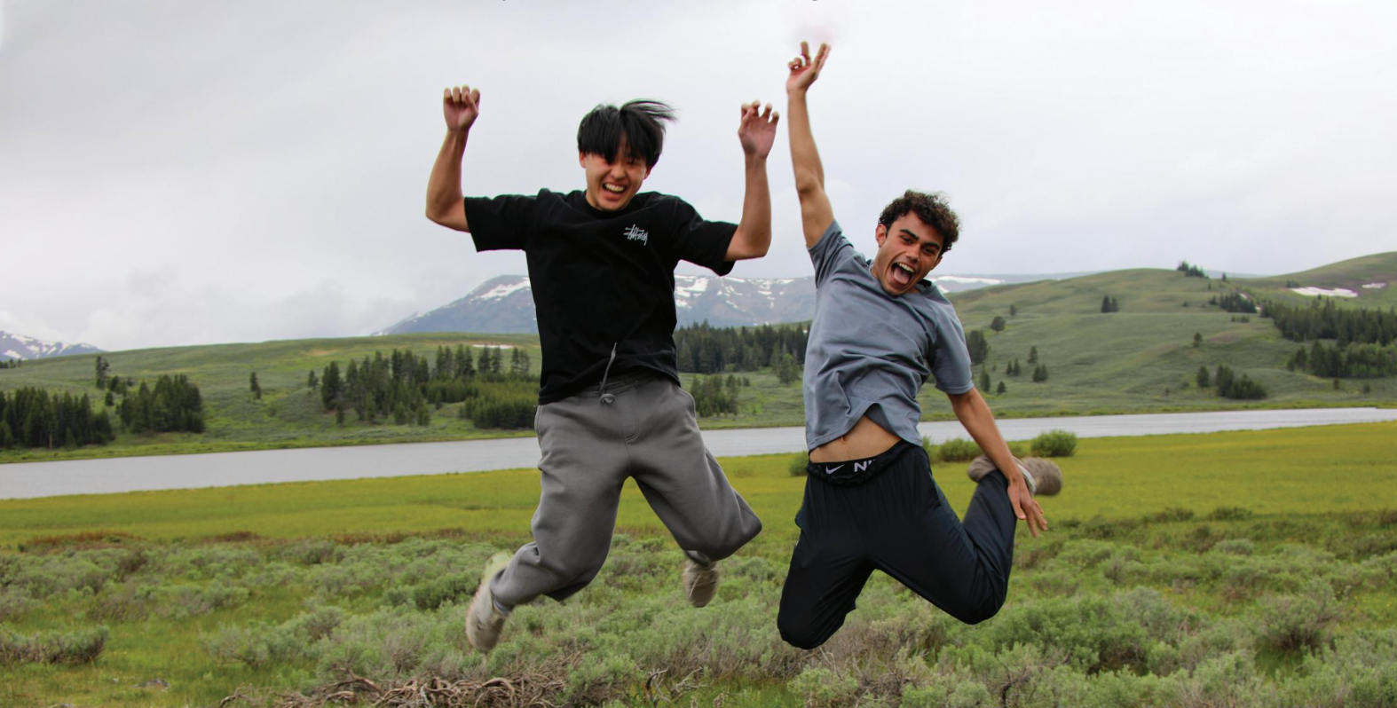 kids jumping in a field