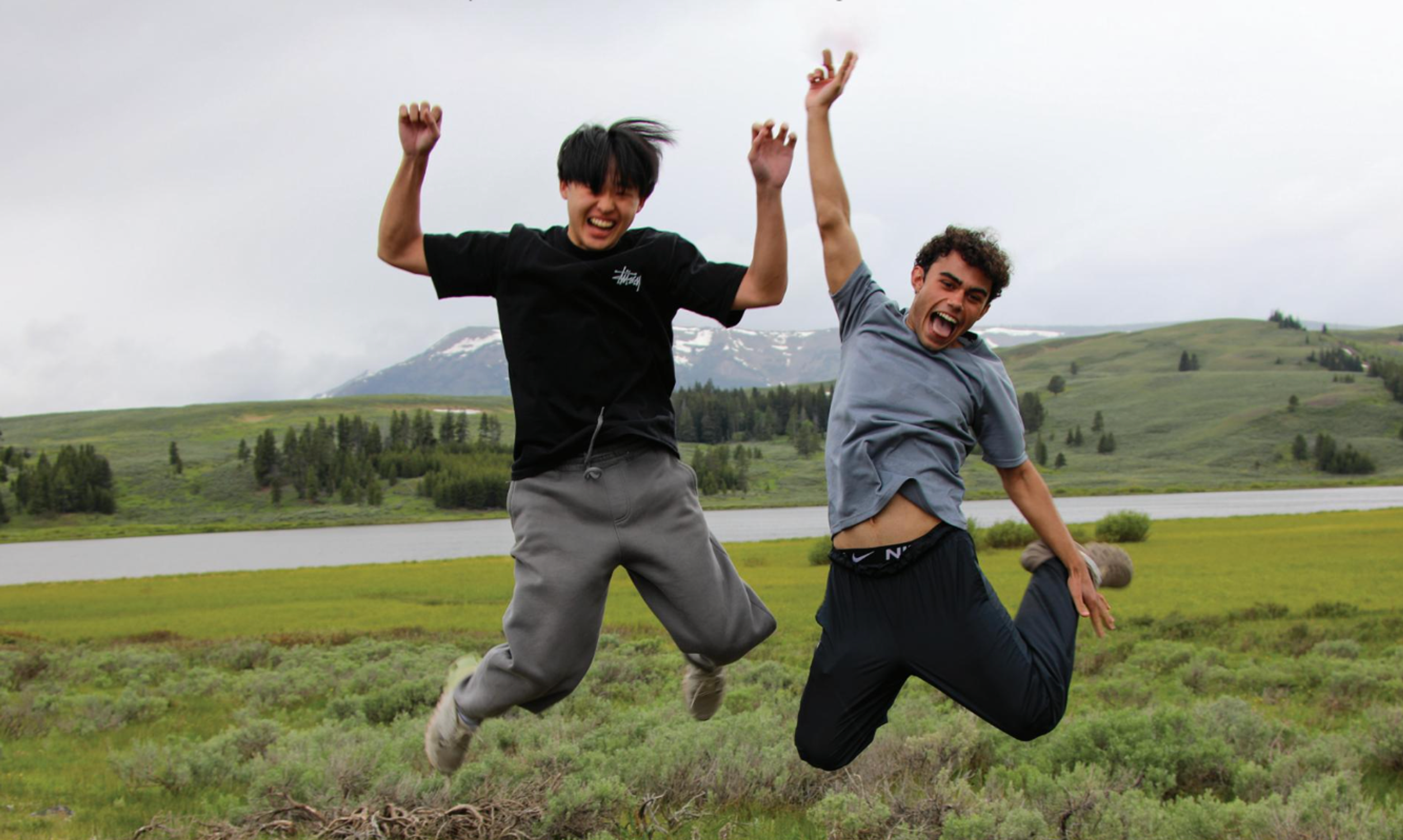kids jumping in a field