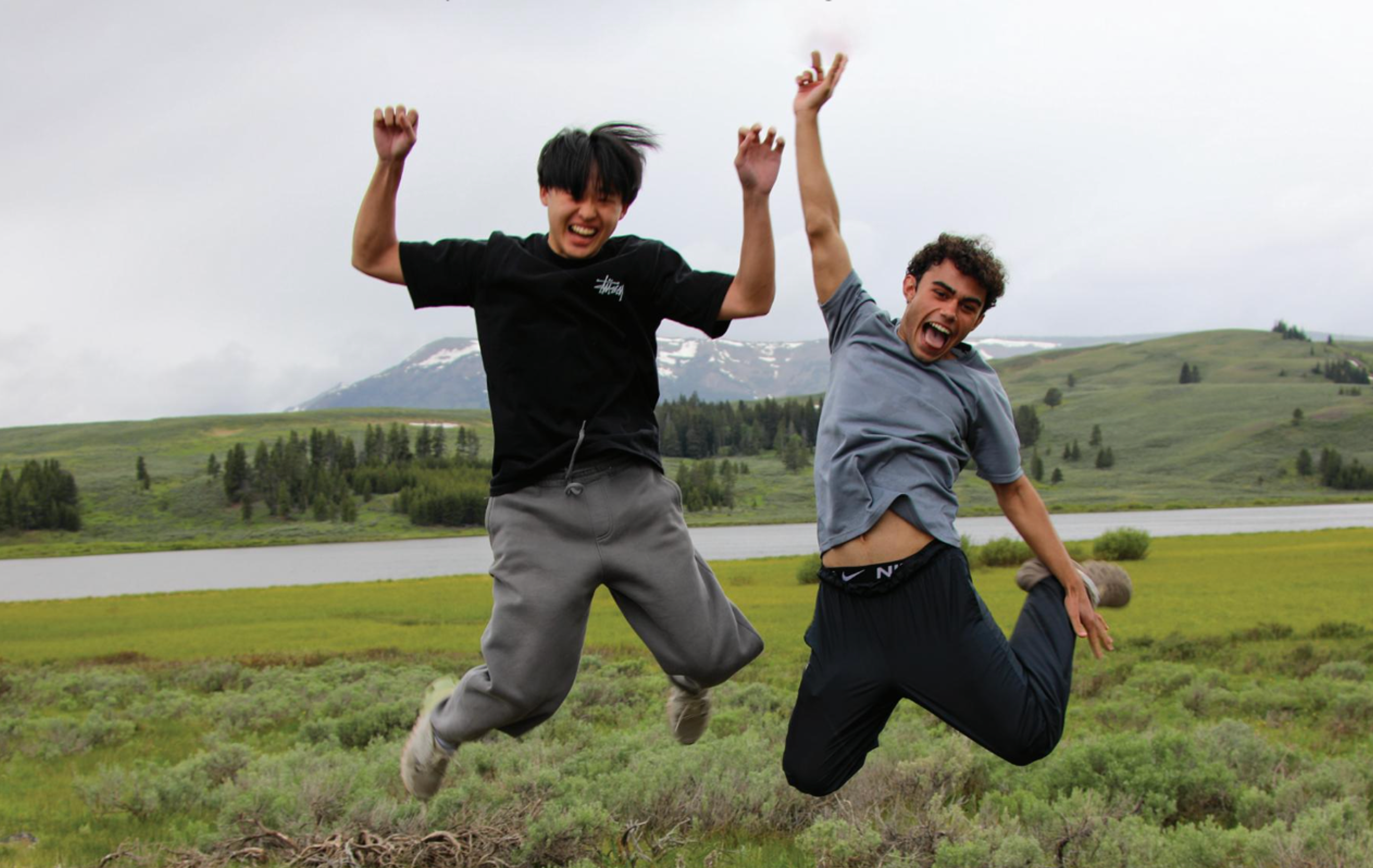 kids jumping in a field