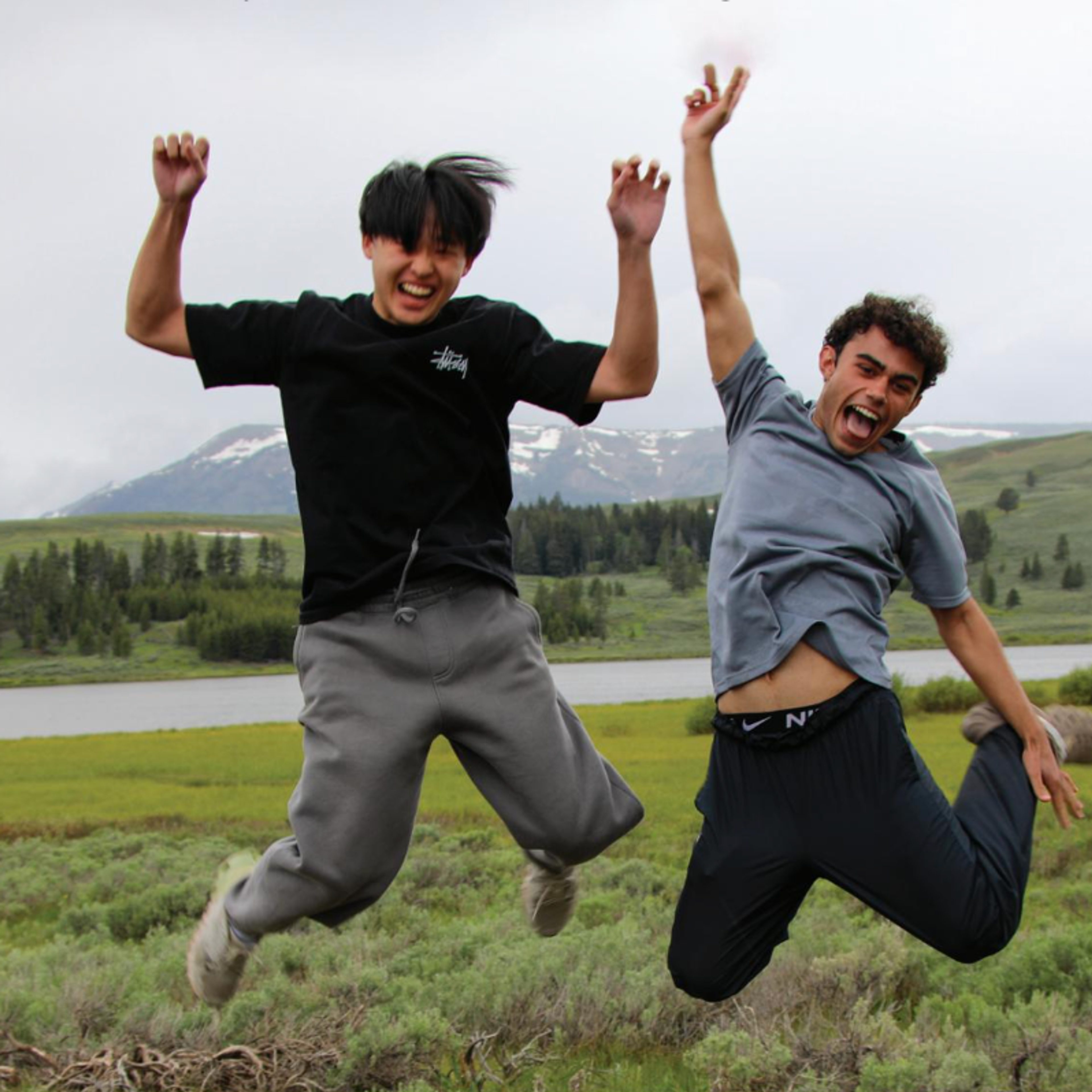 kids jumping in a field