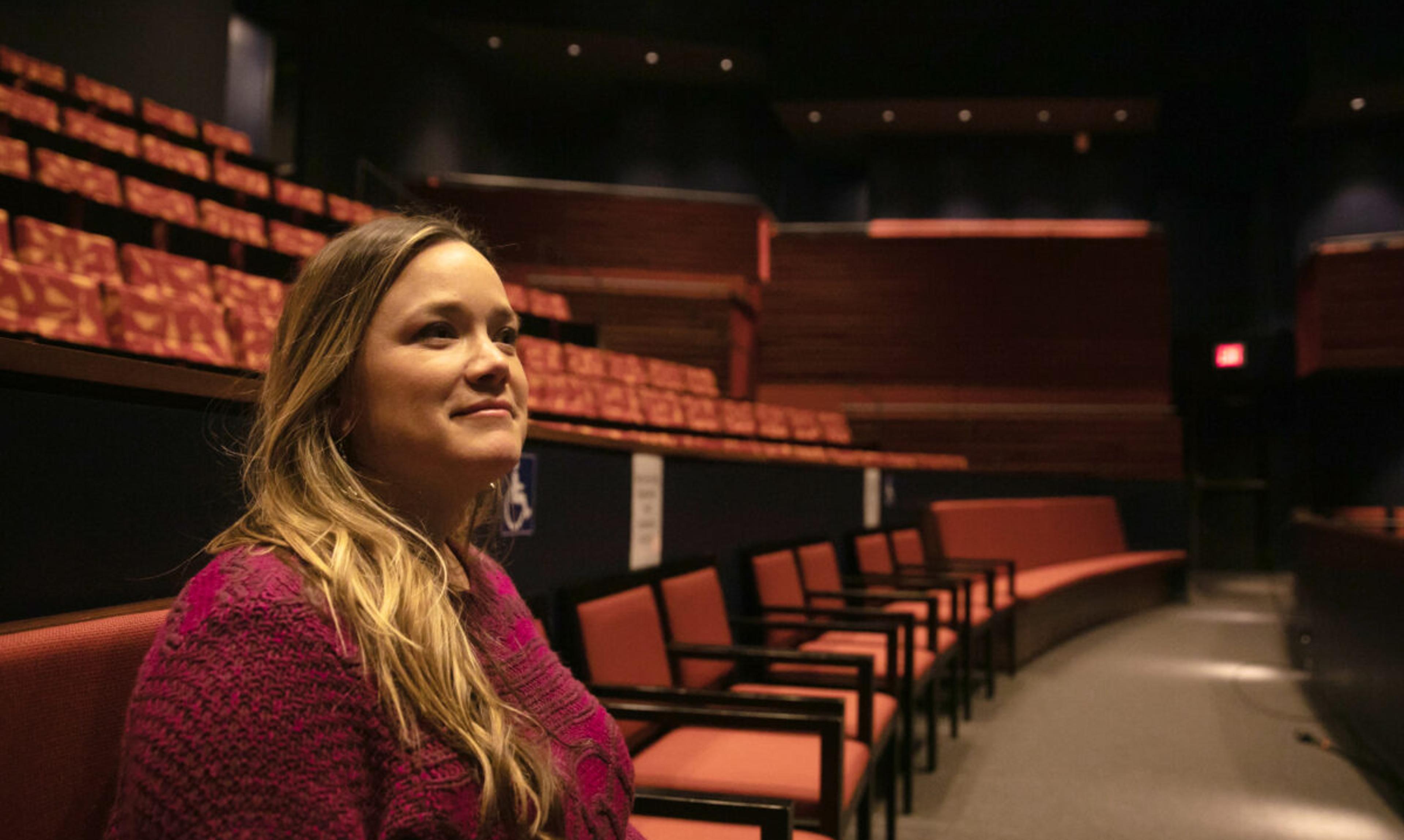Woman sitting in theater