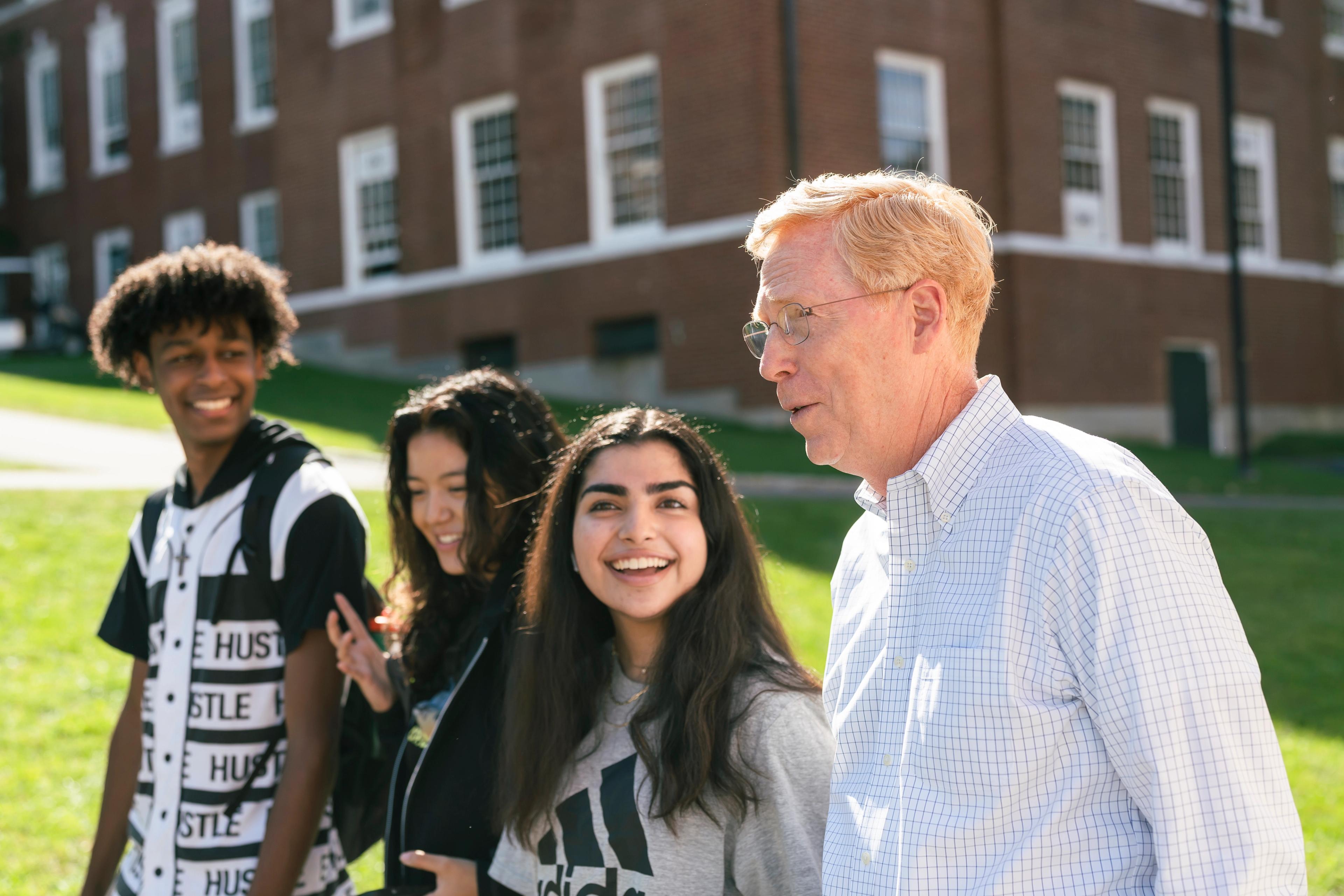 Rawson walks with students on path