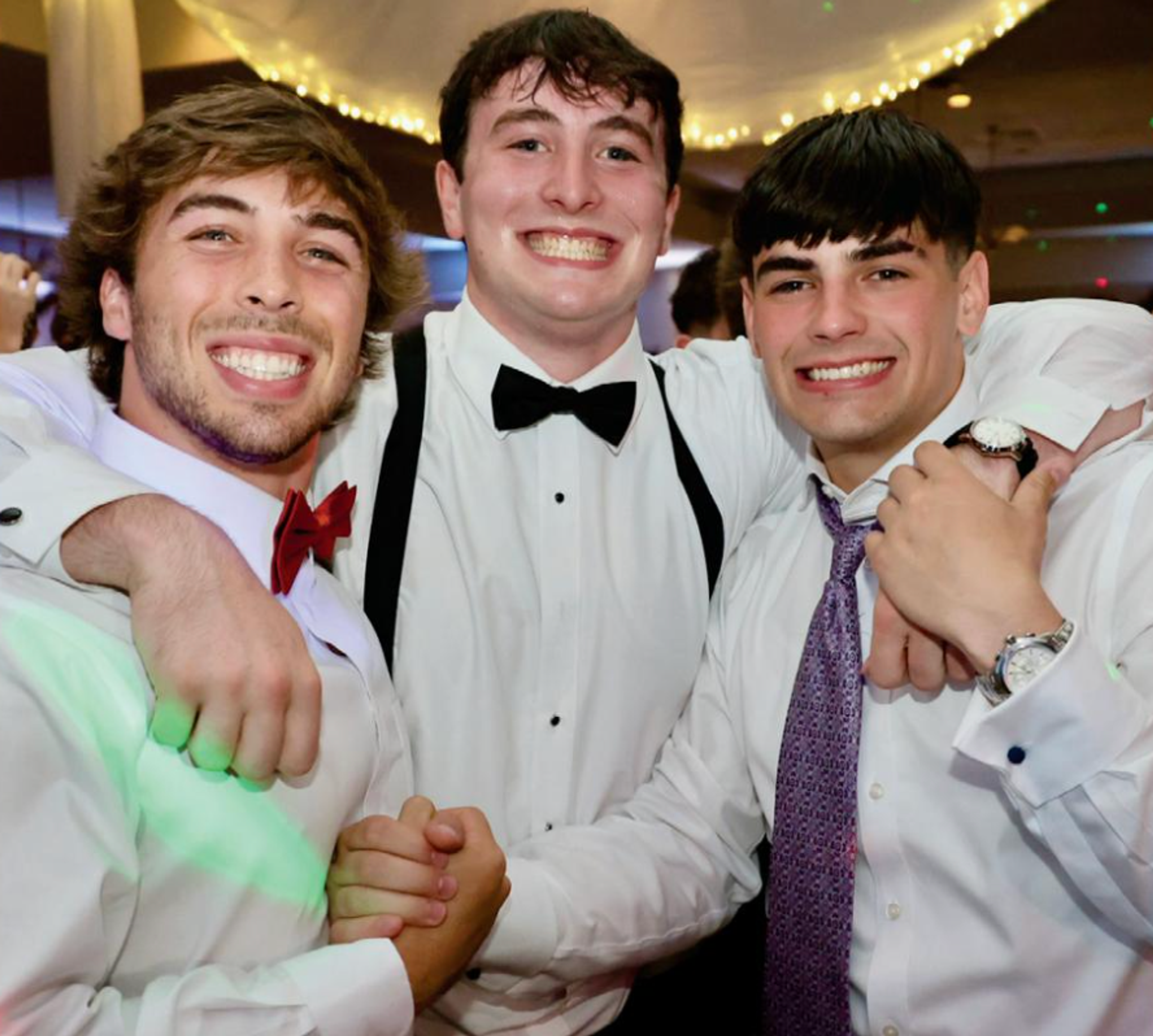 guys smiling and holding hands