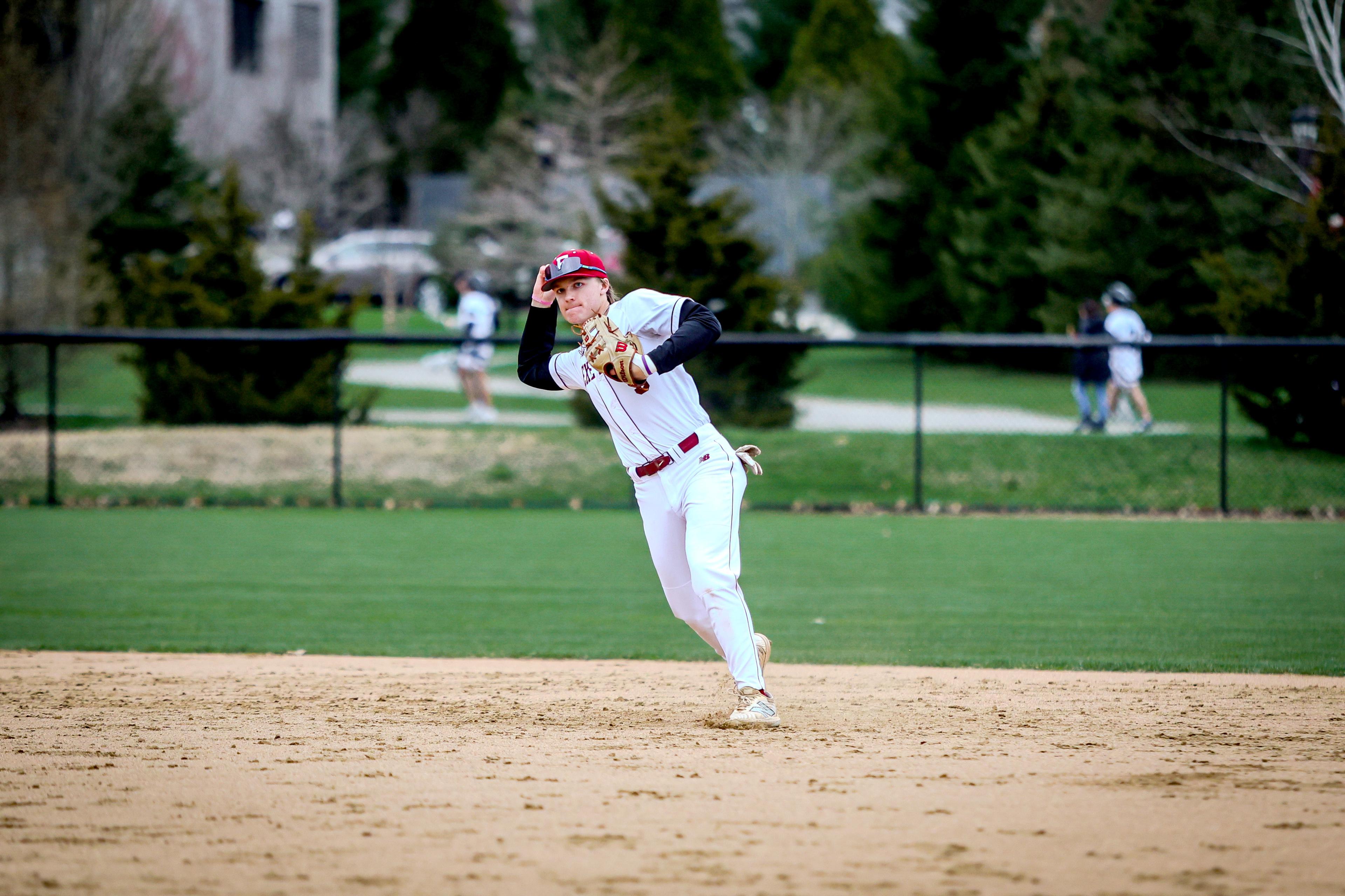 Boy throws baseball