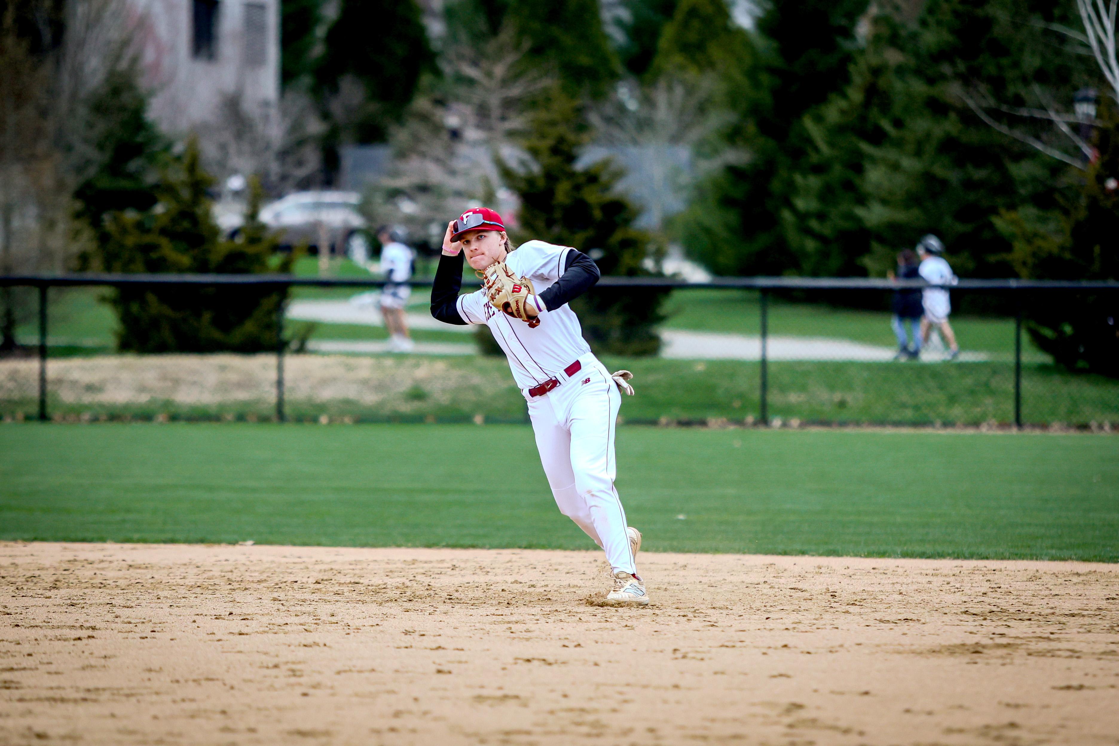 Boy throws baseball