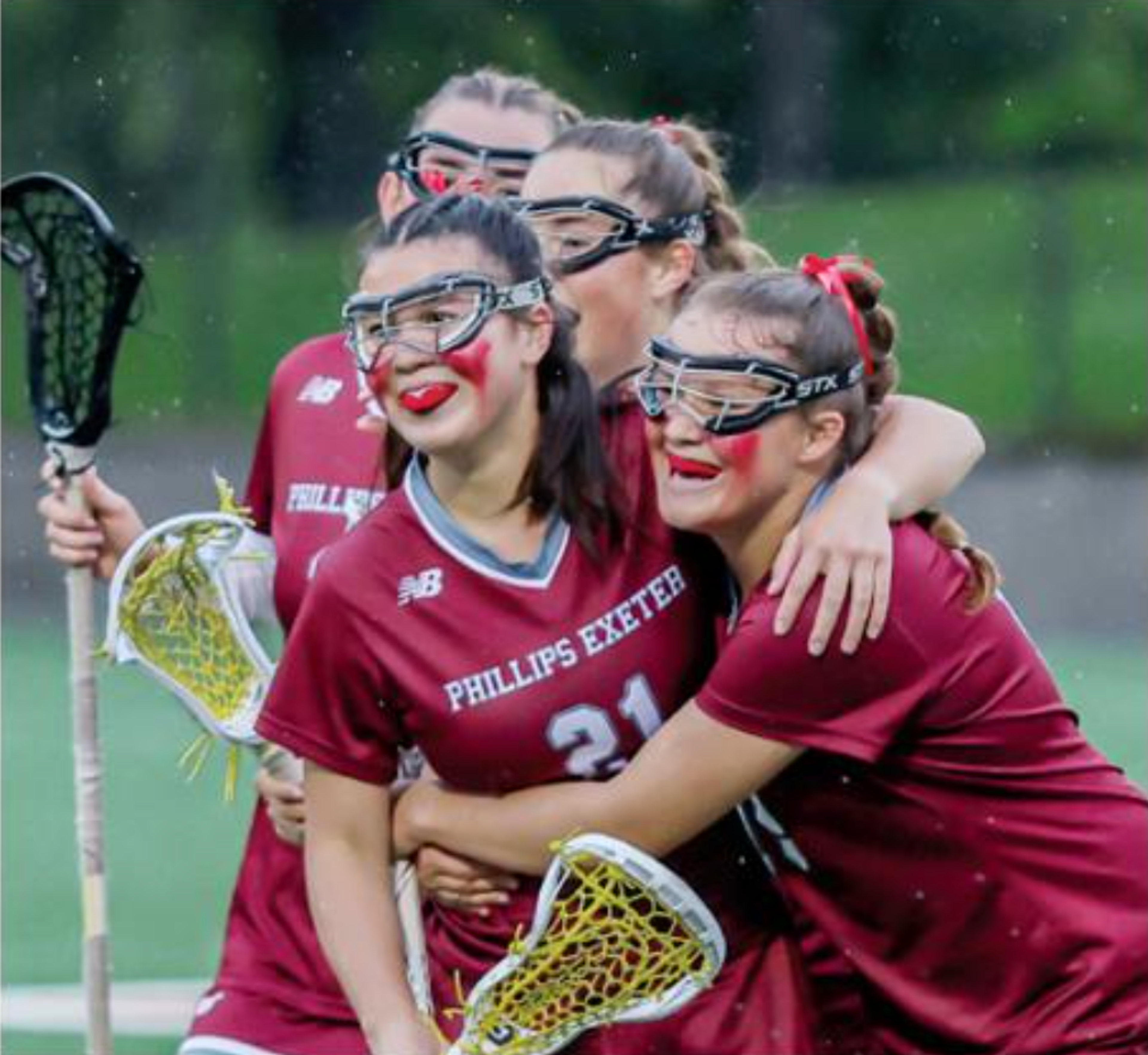 lacrosse players hugging