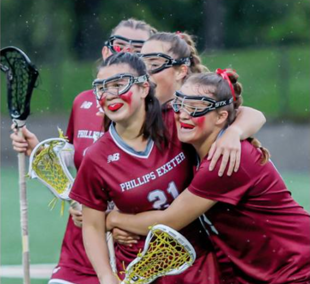 lacrosse players hugging