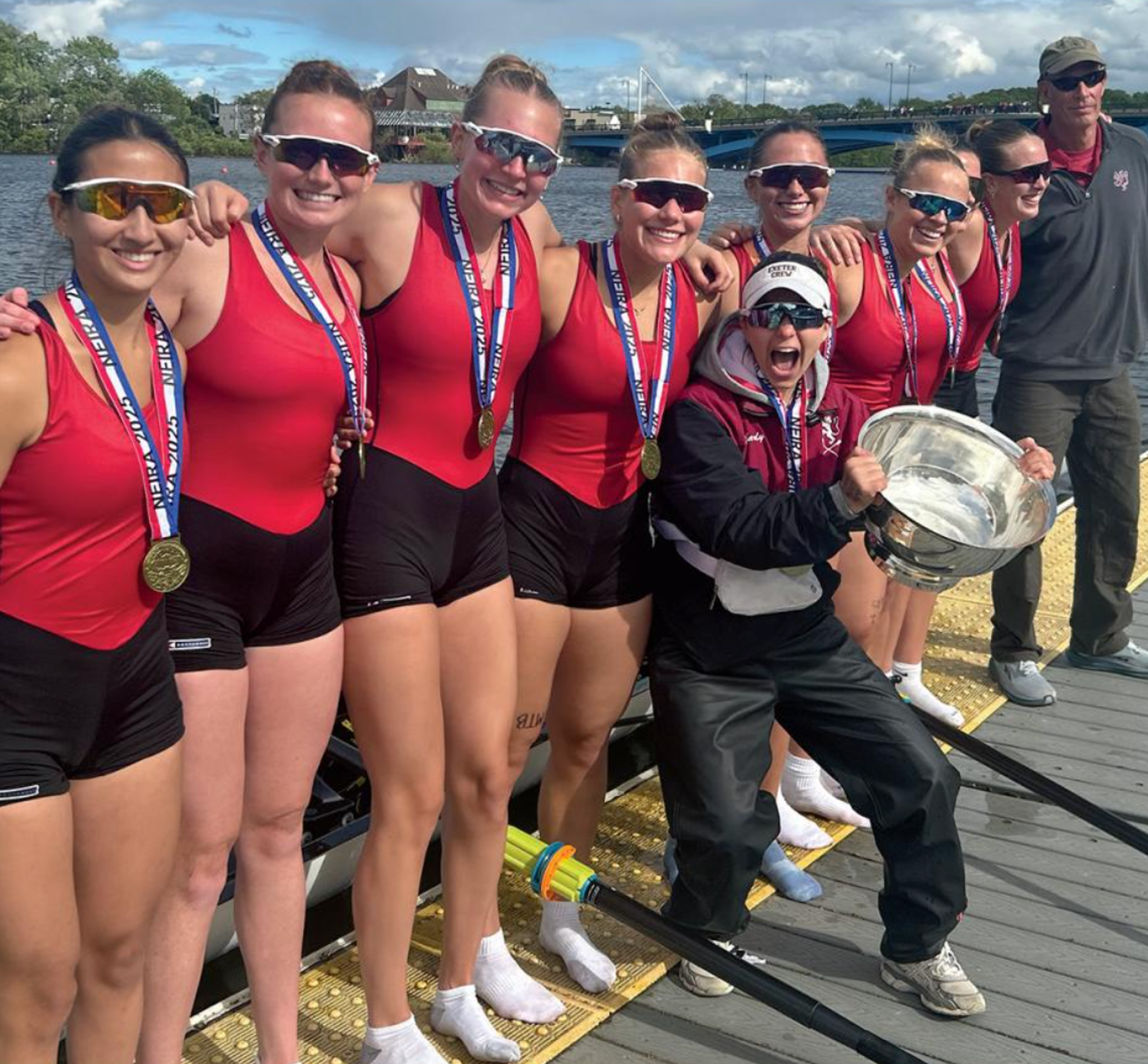 girls crew with a trophy