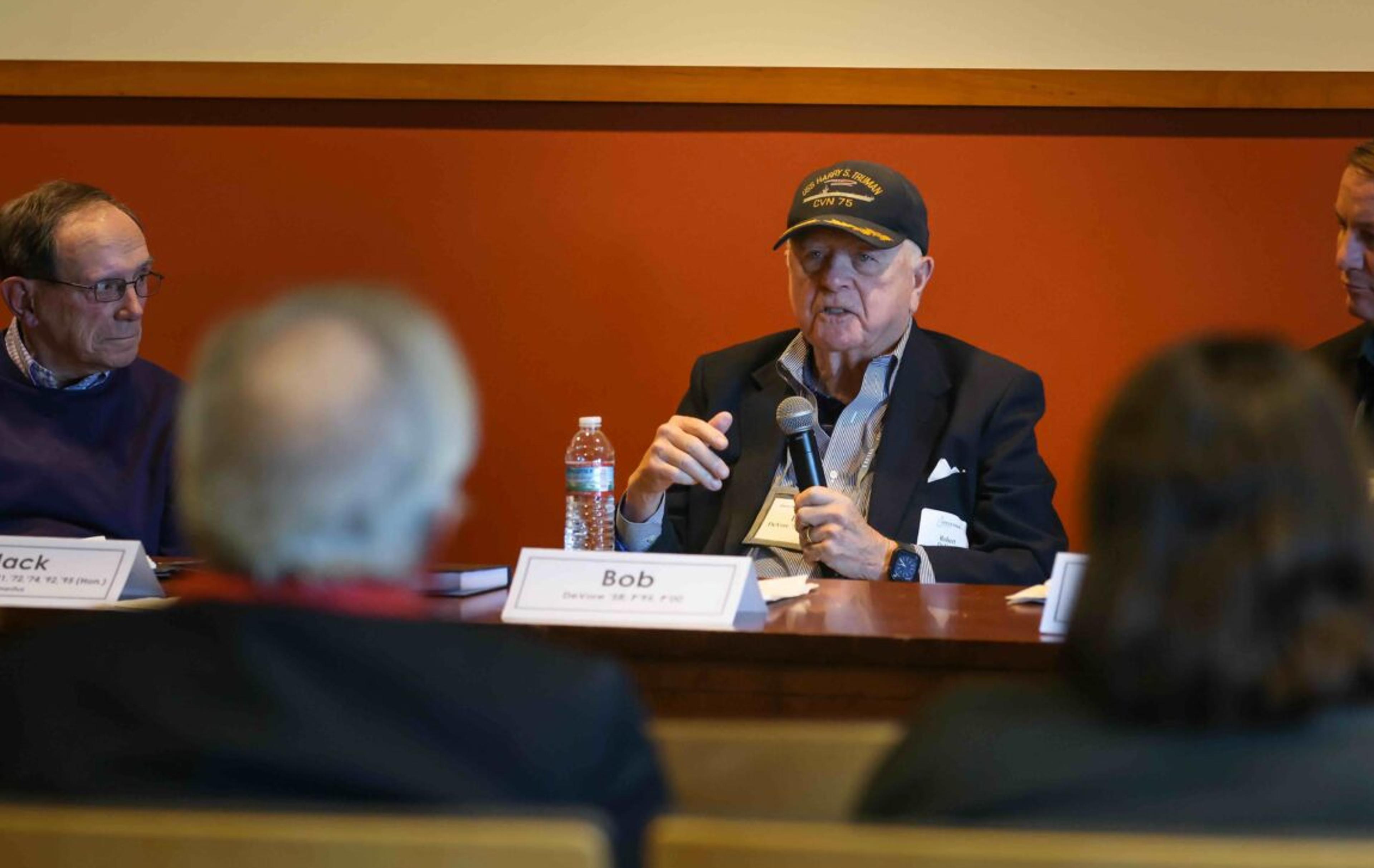 A man speaking on a panel