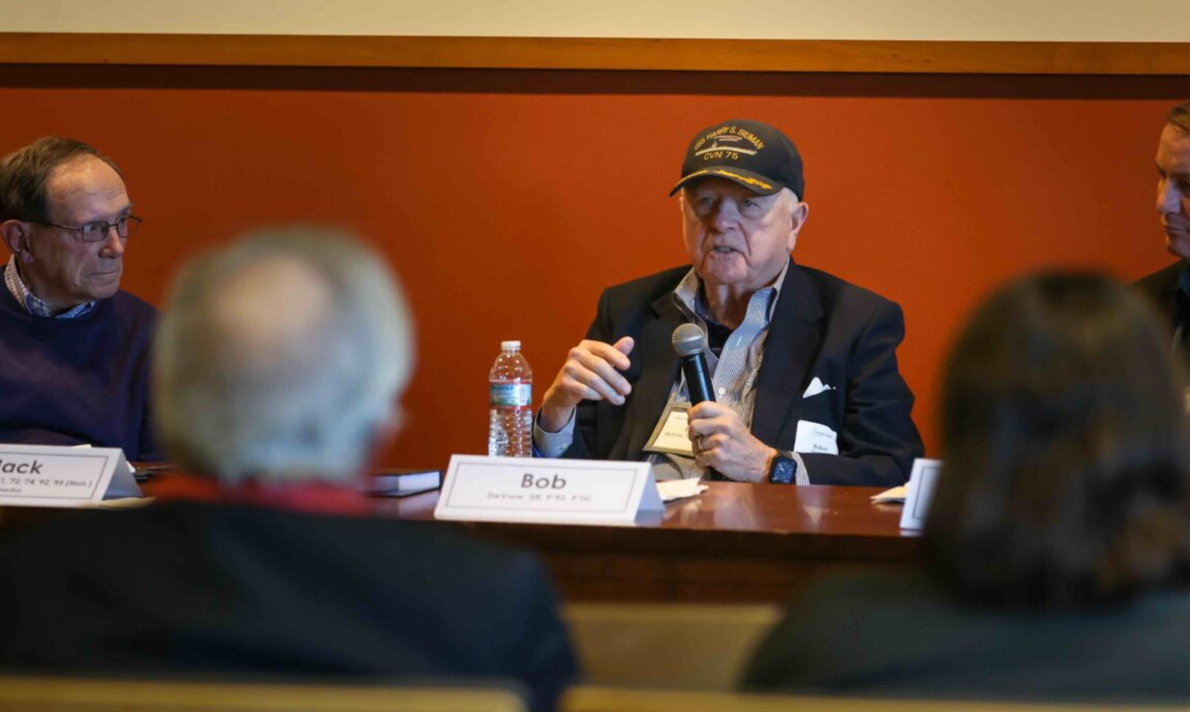 A man speaking on a panel