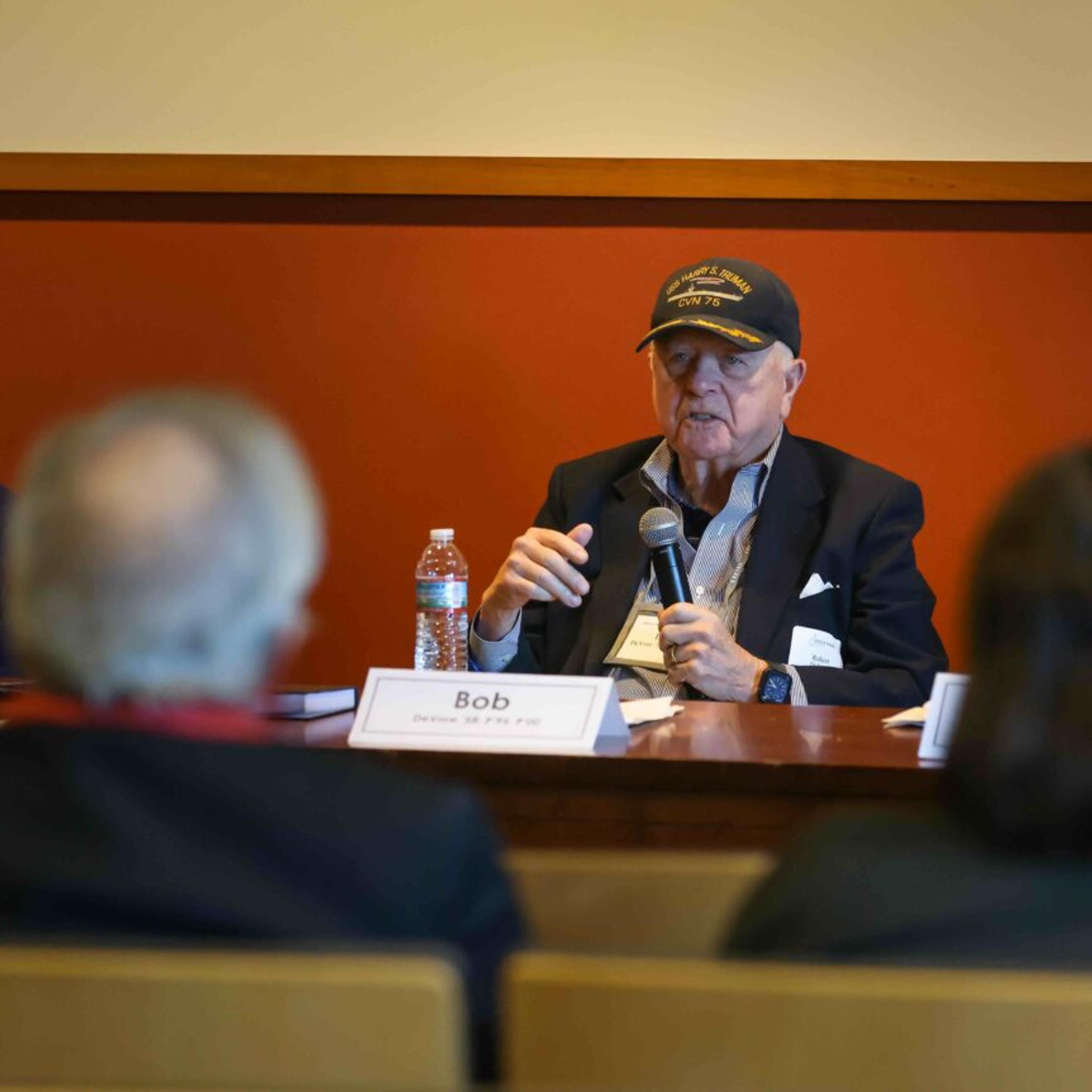 A man speaking on a panel