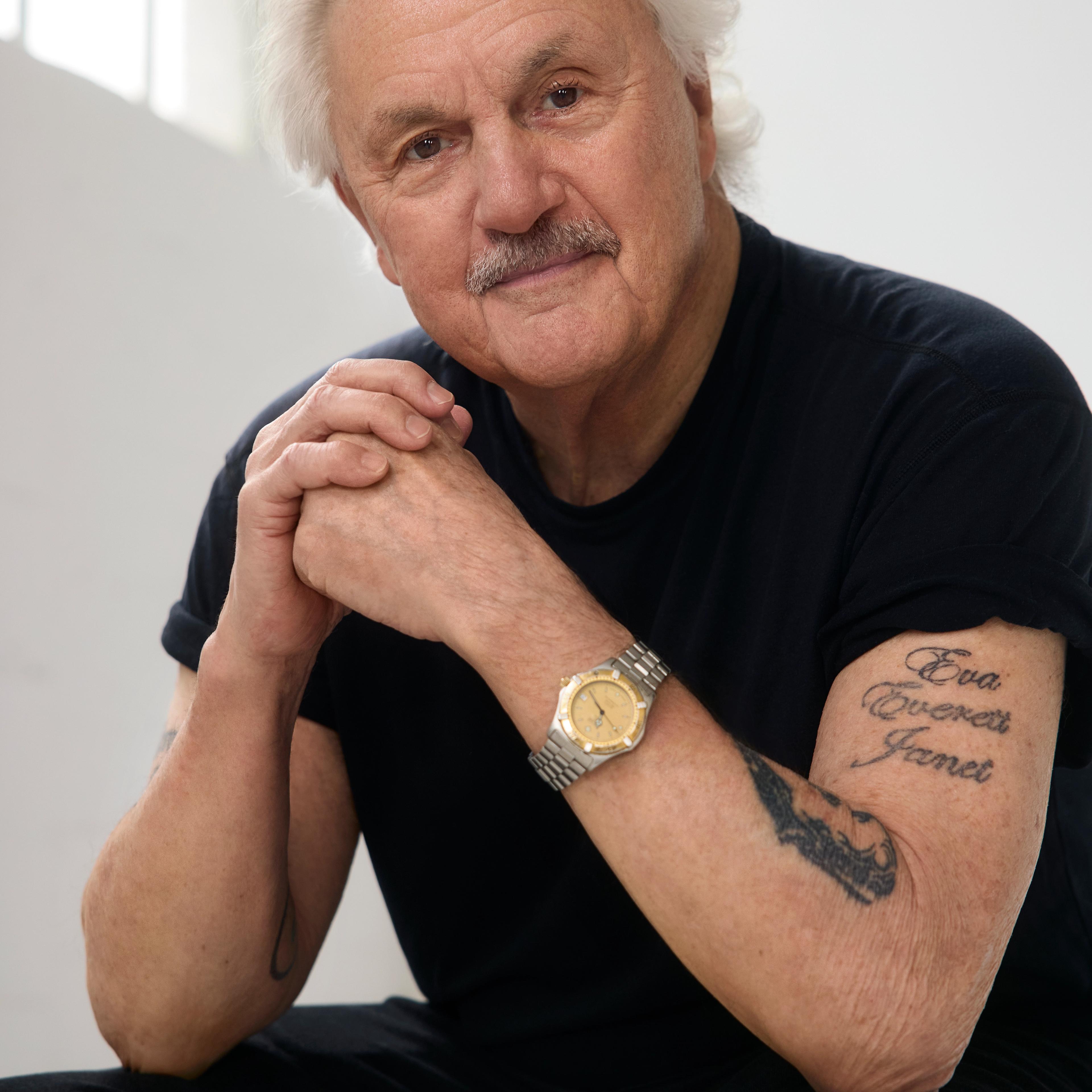 man with watch and black tshirt