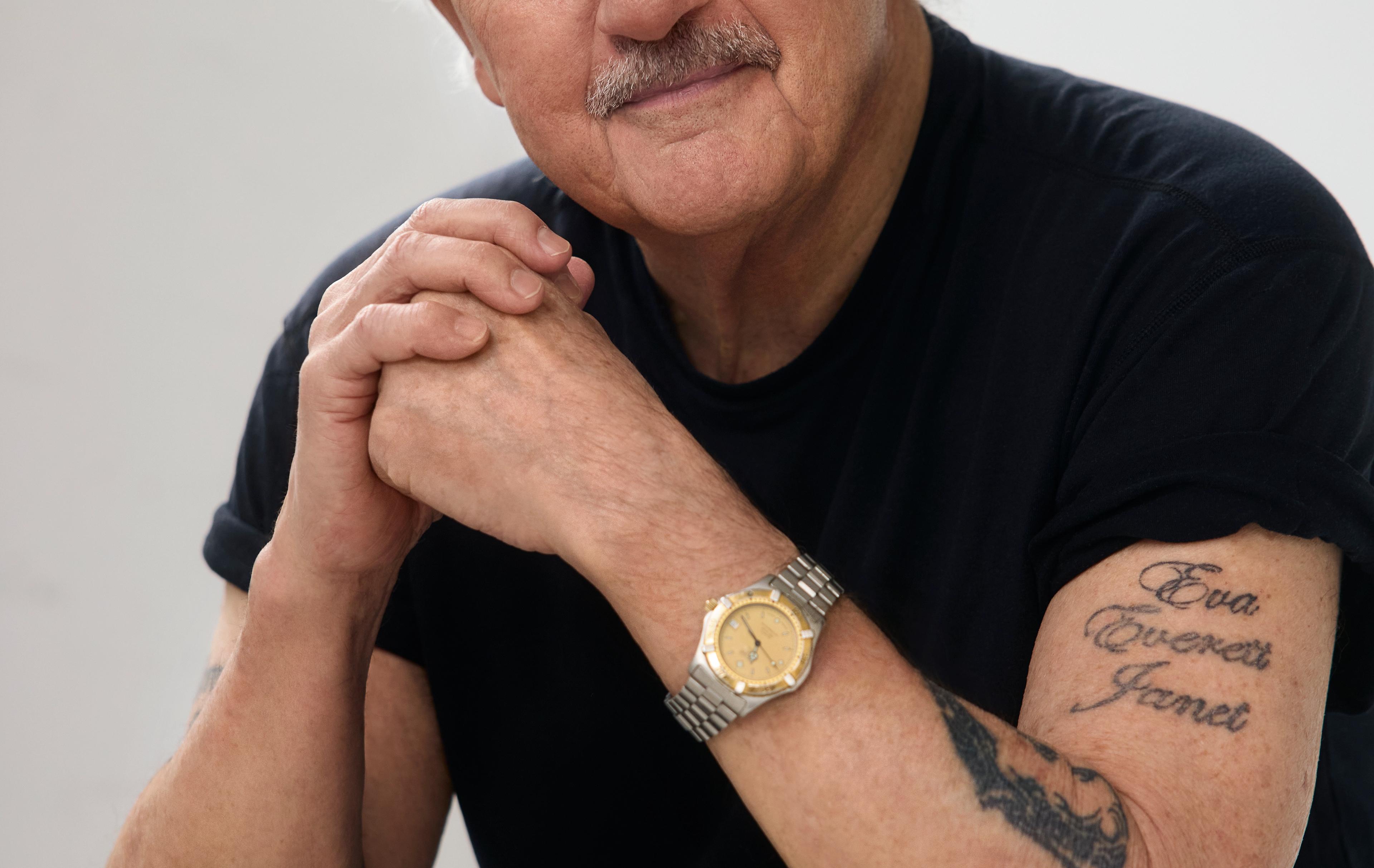 man with watch and black tshirt