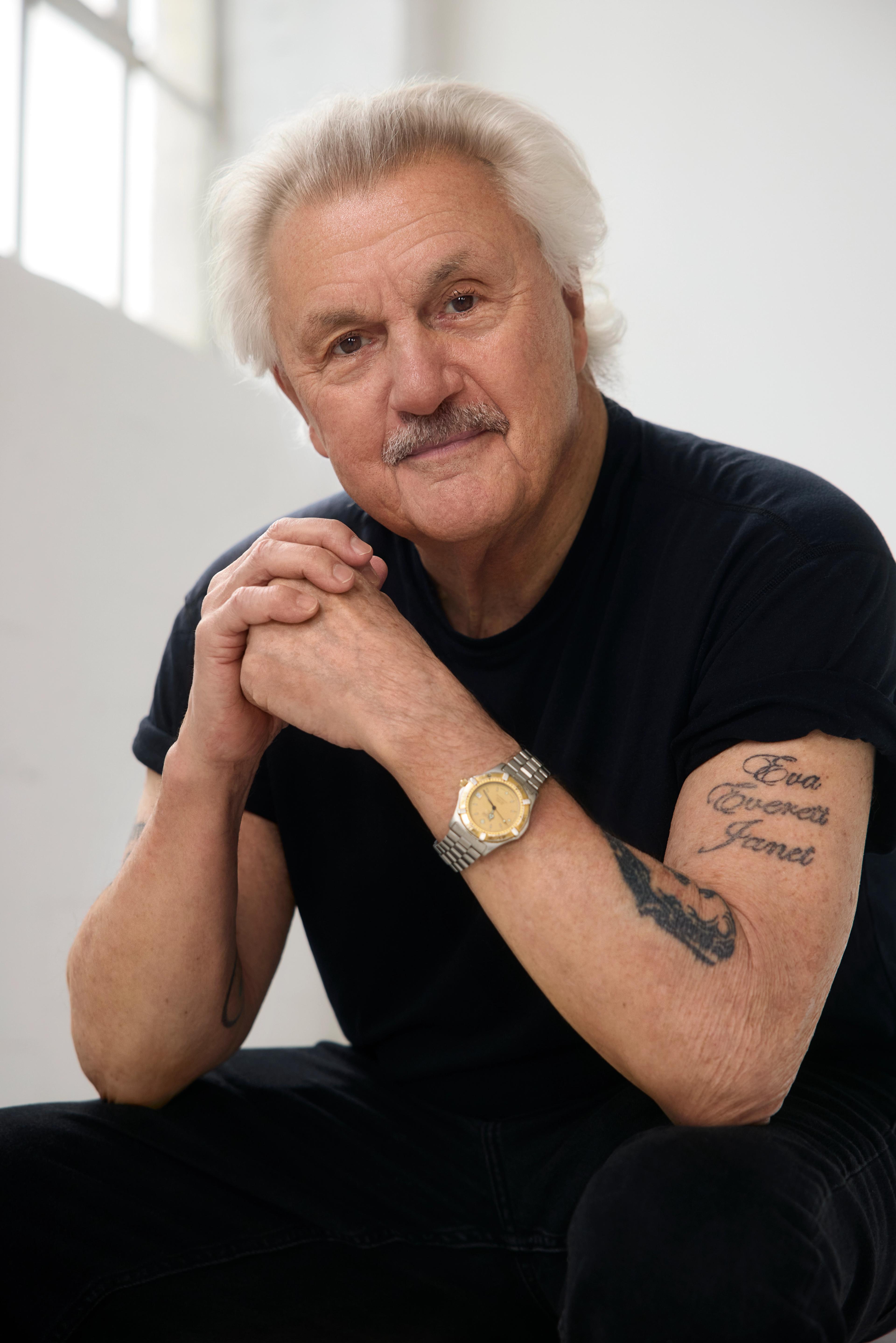 man with watch and black tshirt