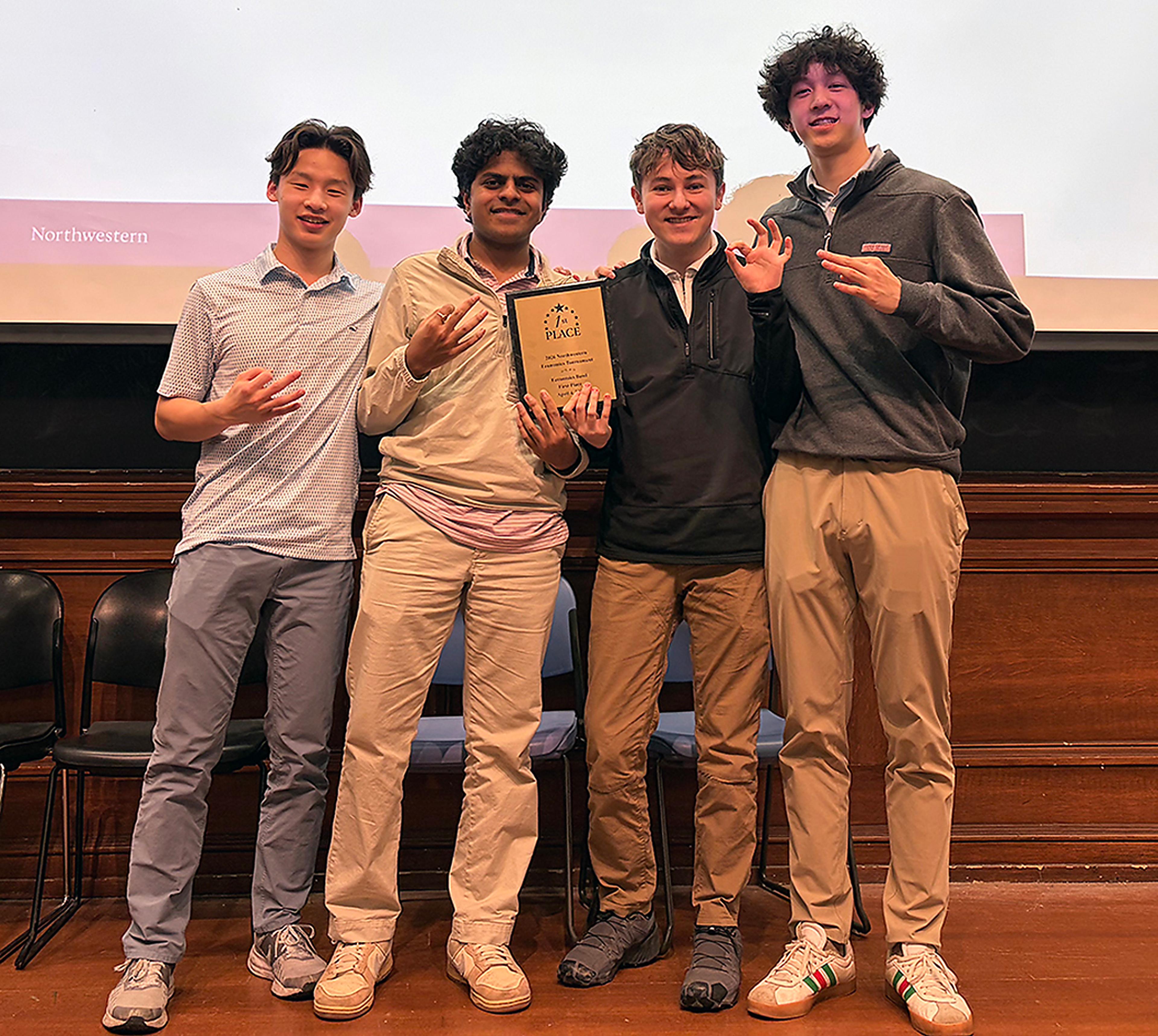 Boys stand on stage to accept award