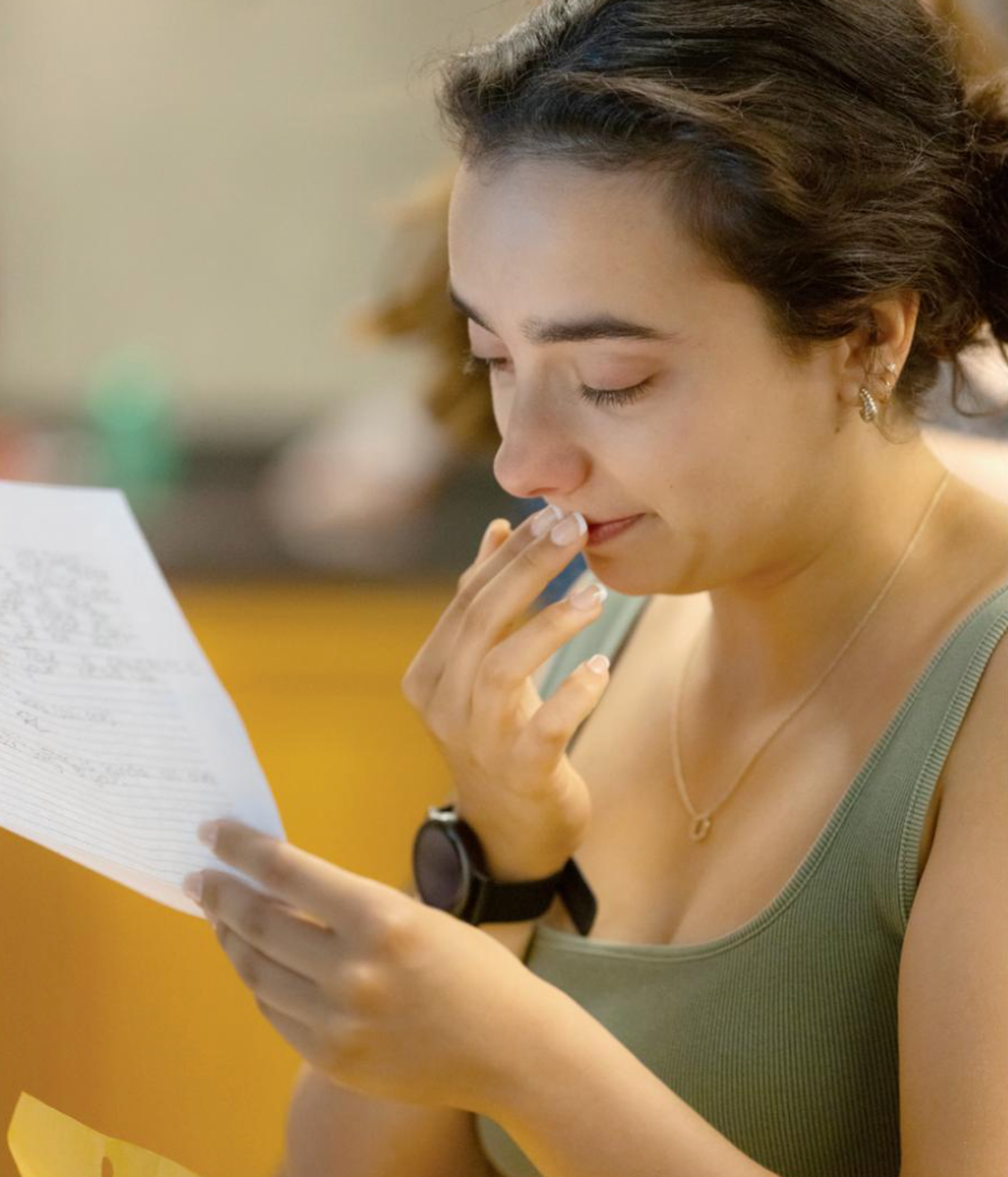 woman reading a piece of paper